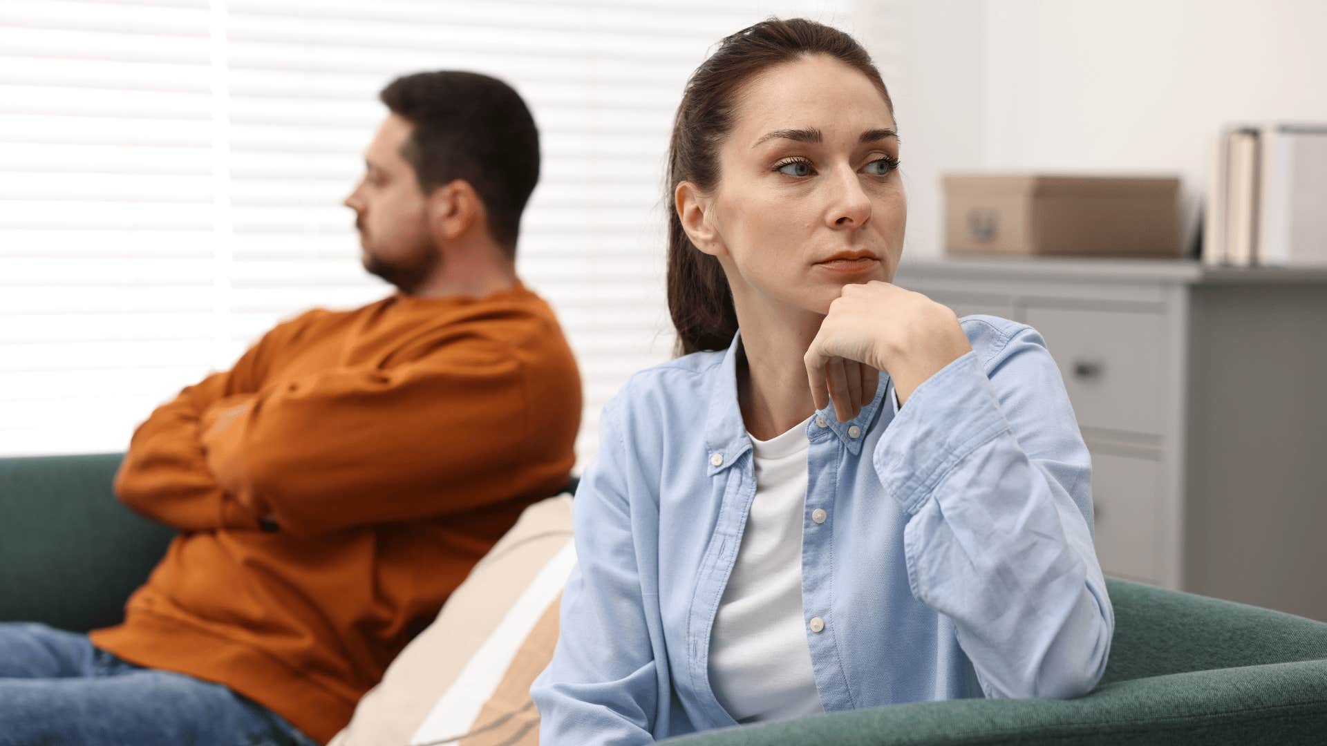 woman and man ignoring each other