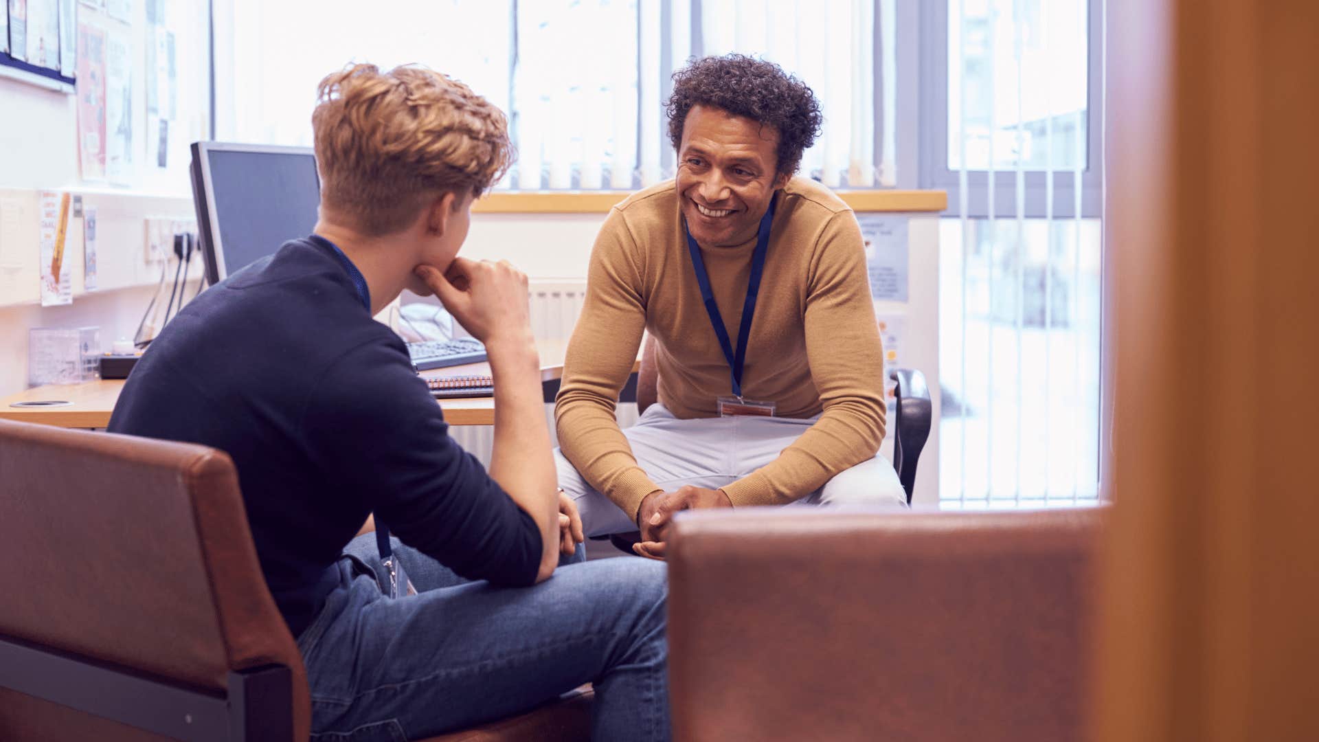 college student sitting down with counselor 