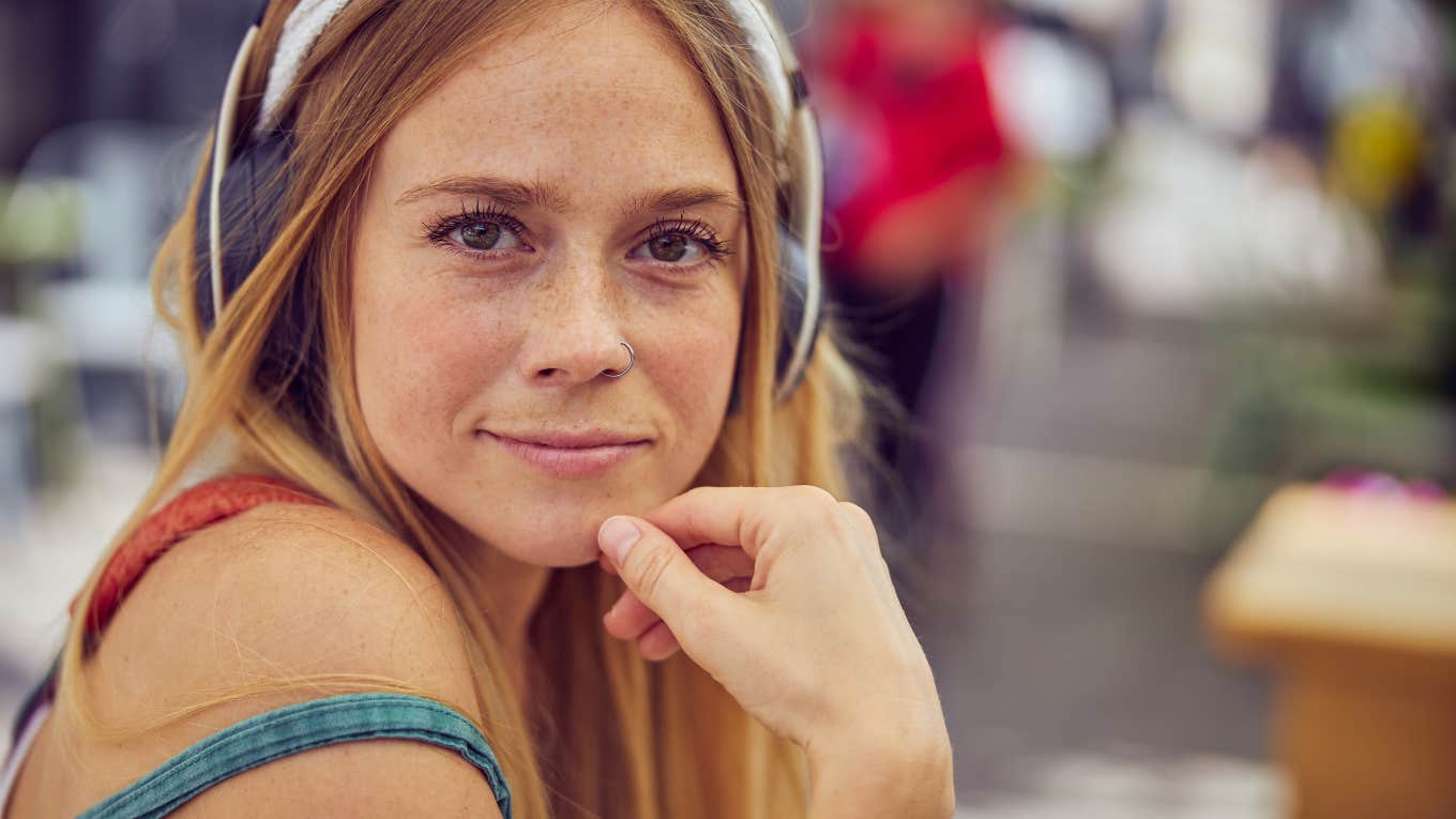 curious woman with hand on chin