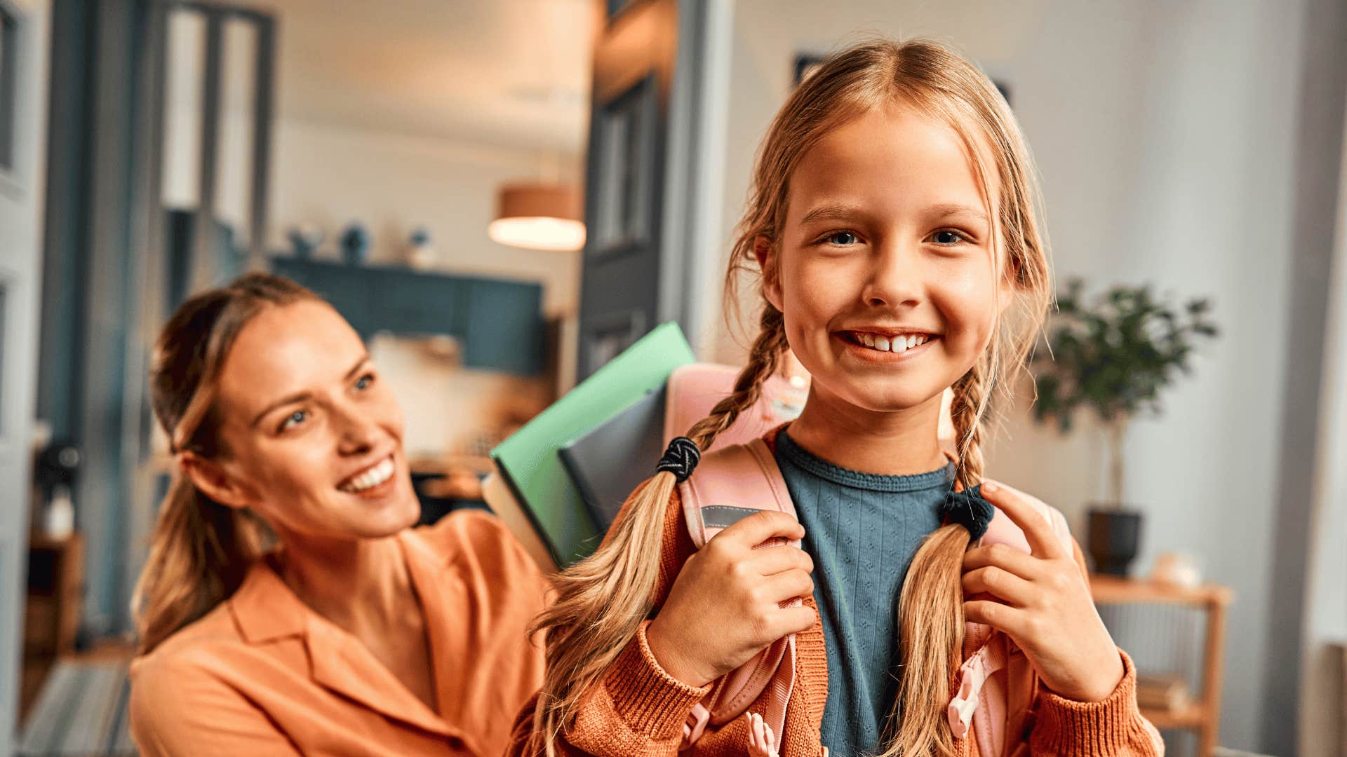 mom packing her daughter's backpack