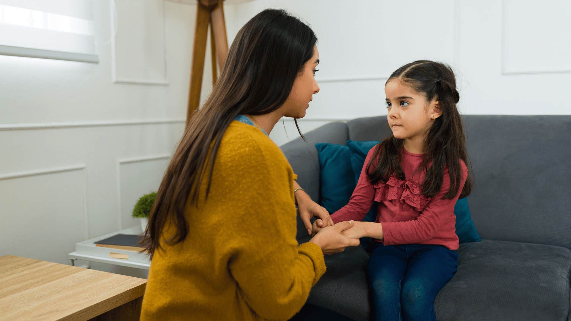 mom talking to young daughter