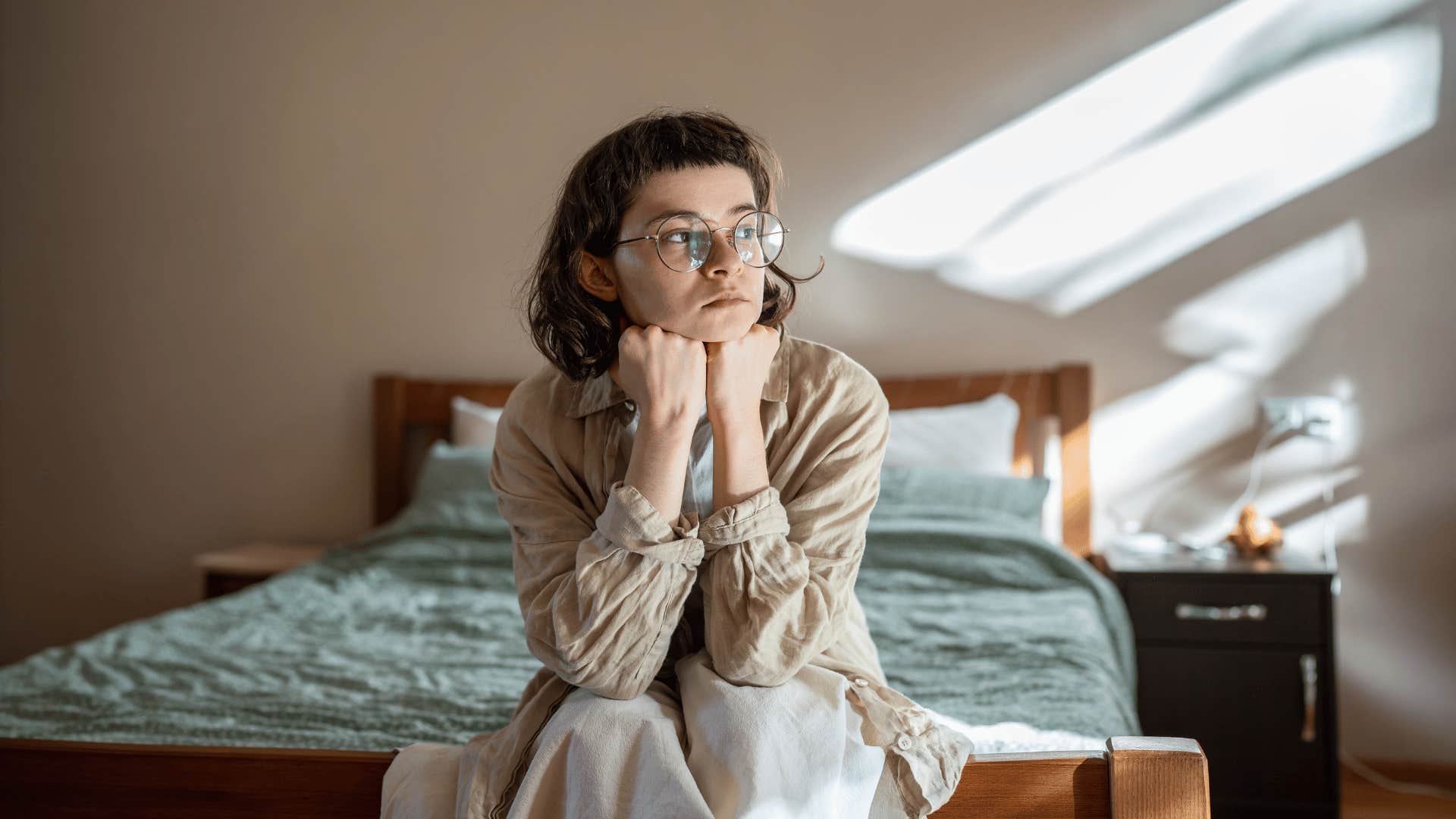 teen in bedroom alone