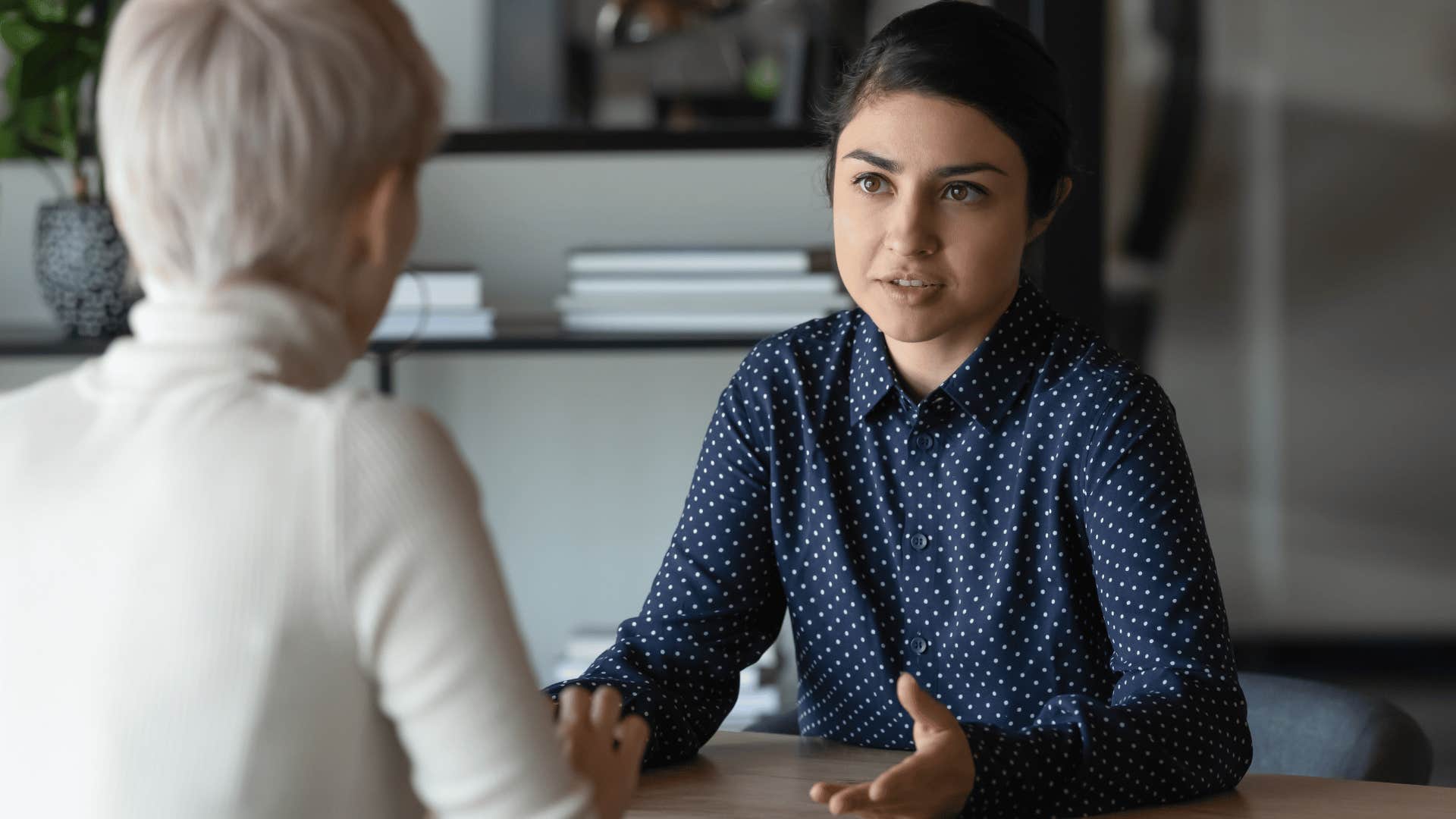 woman explaining something to older woman