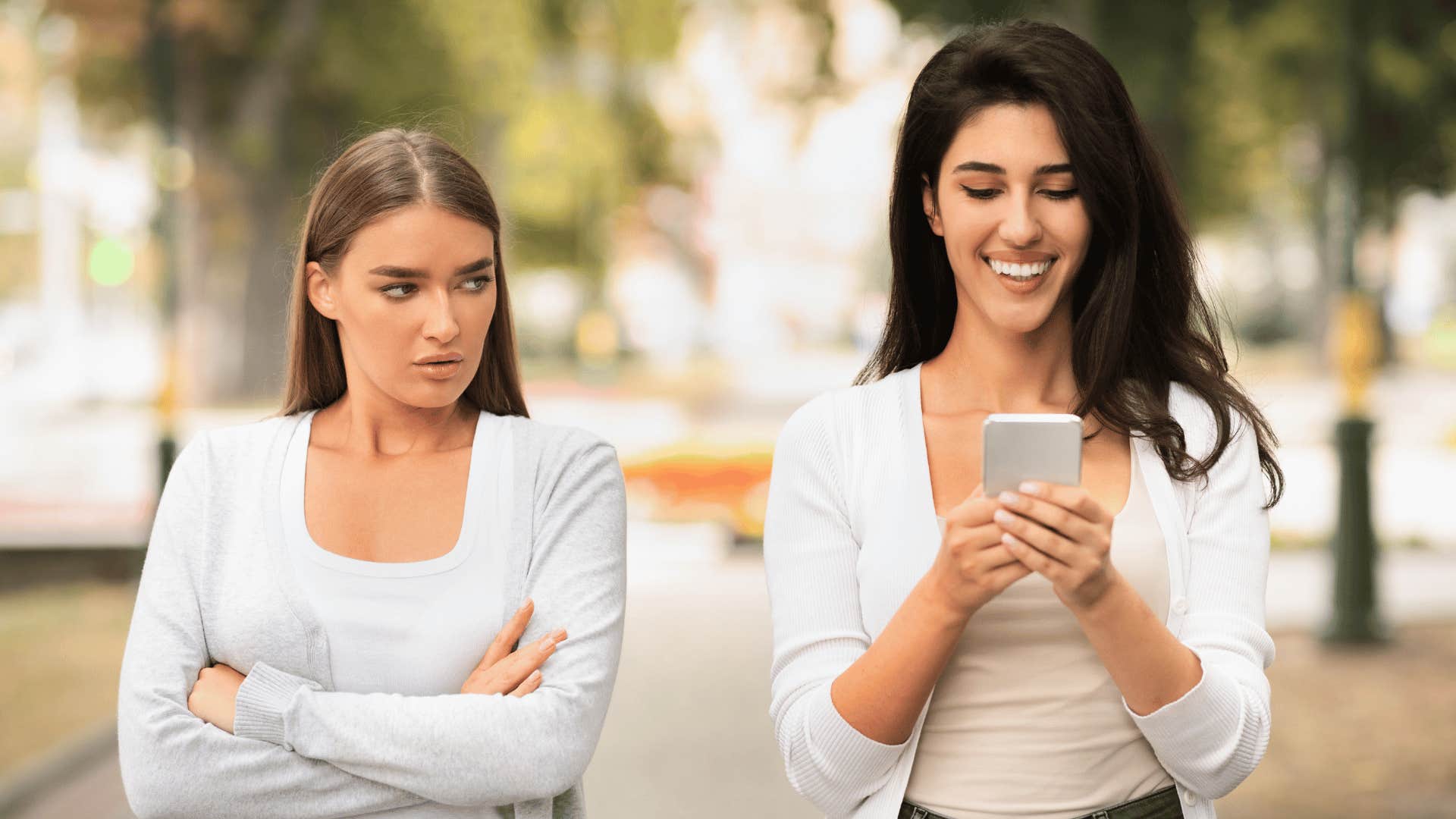 jealous woman looking at friend 