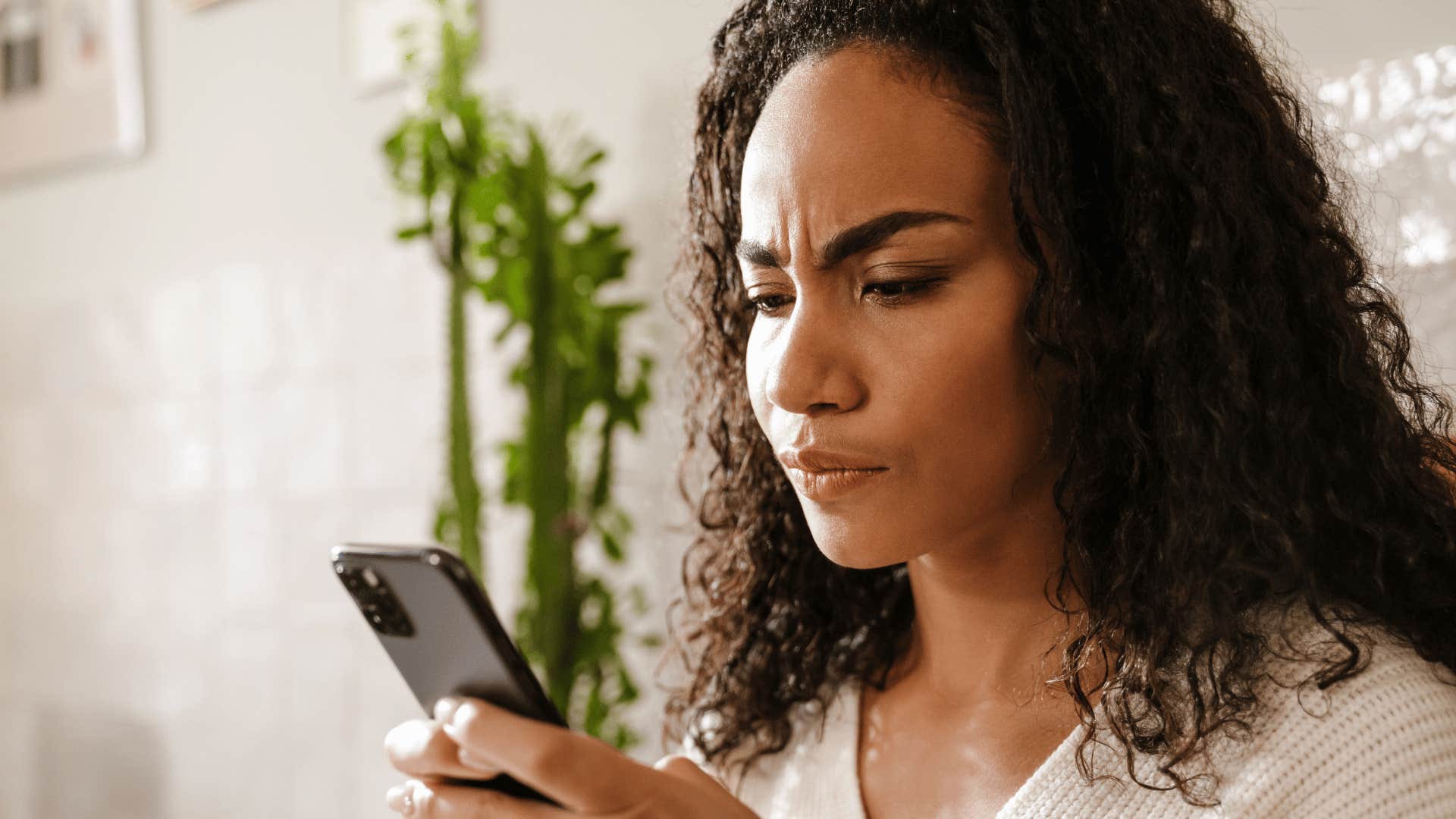 woman looking at phone