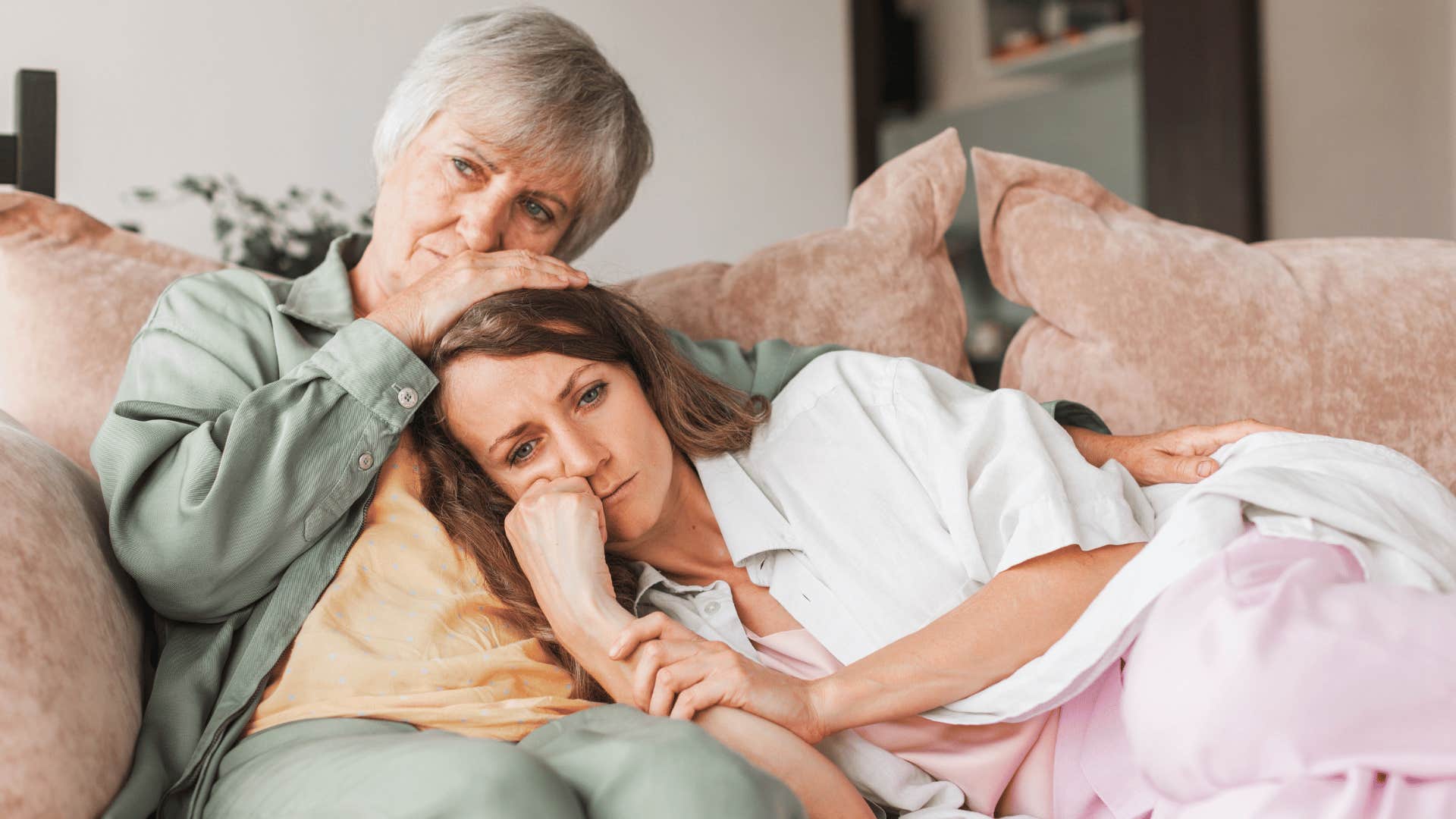 older woman comforting younger woman 