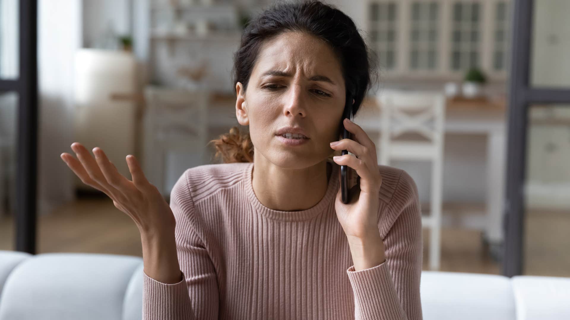 woman on the phone upset 