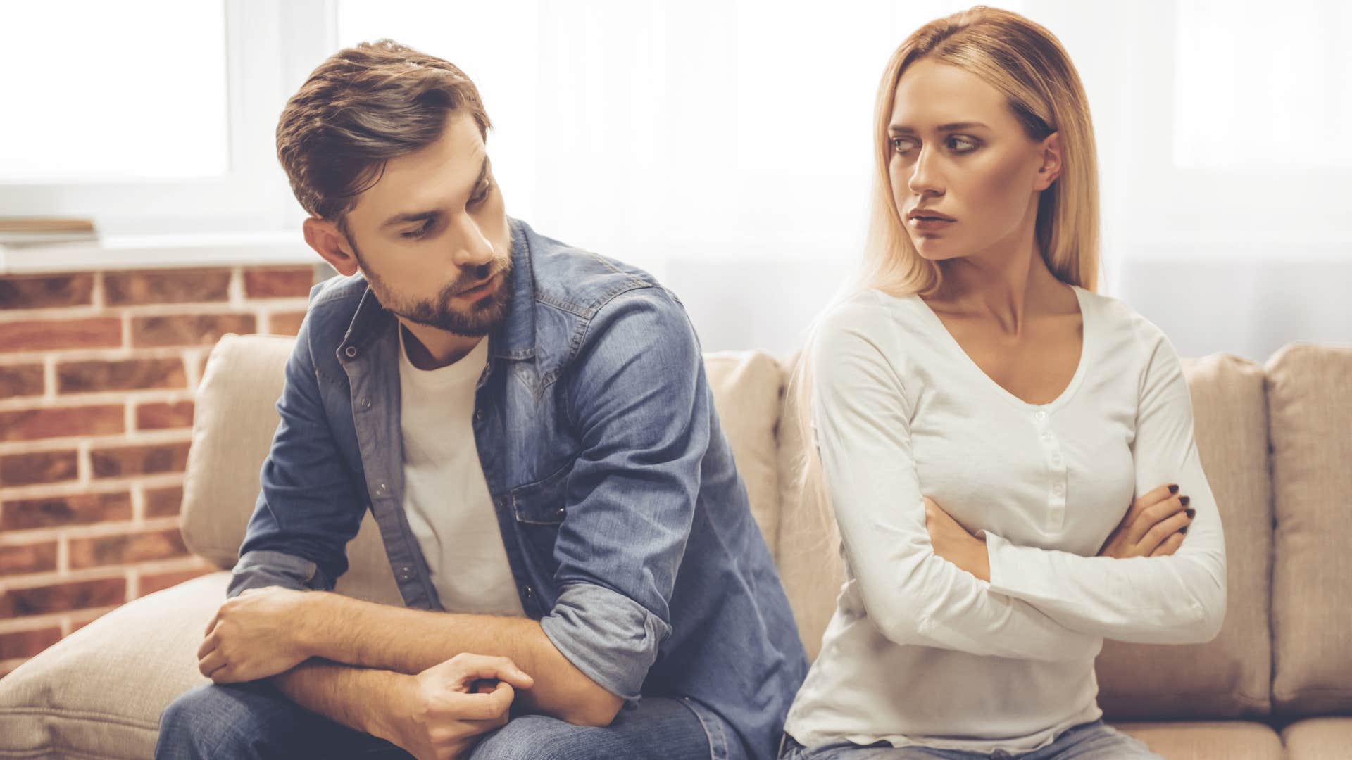 couple arguing on couch