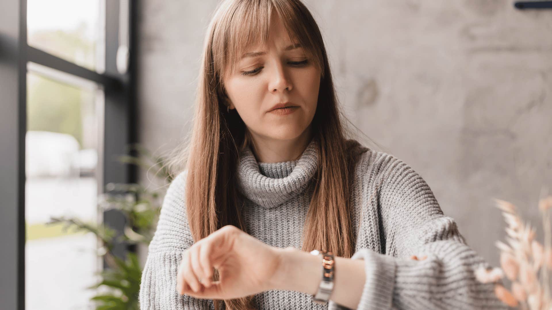 woman looking at watch