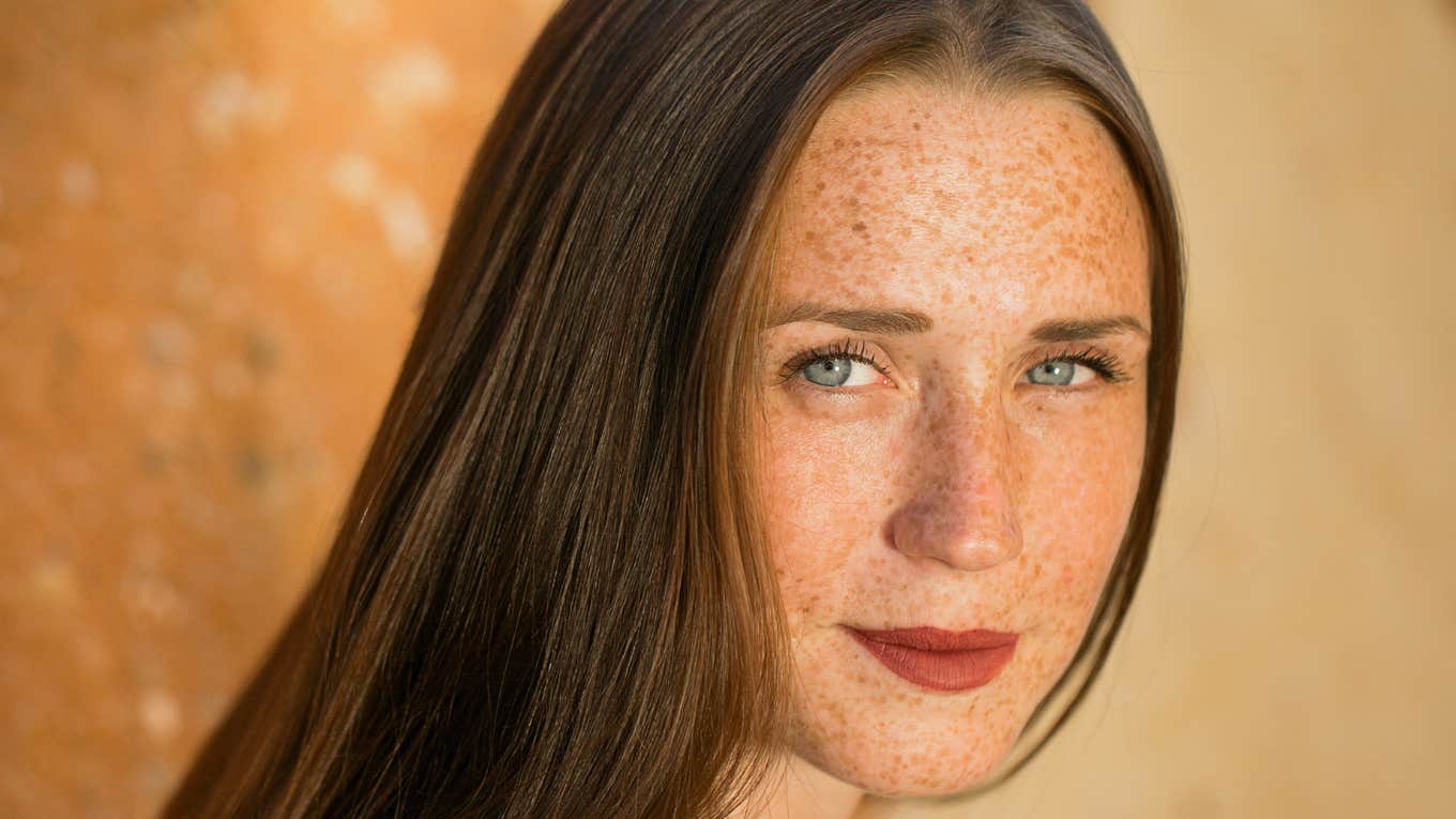 unhappy woman with freckles