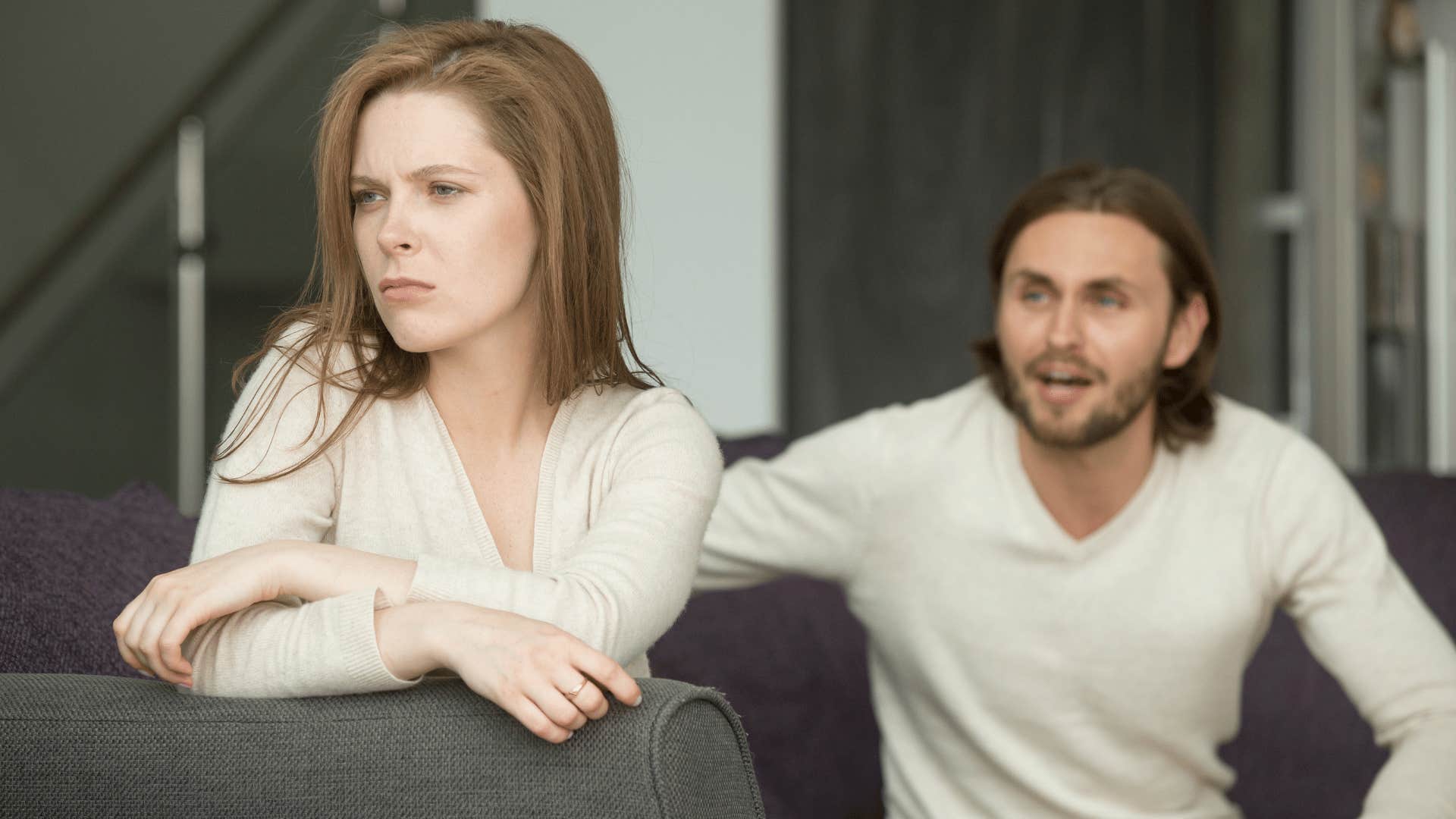 couple arguing on couch