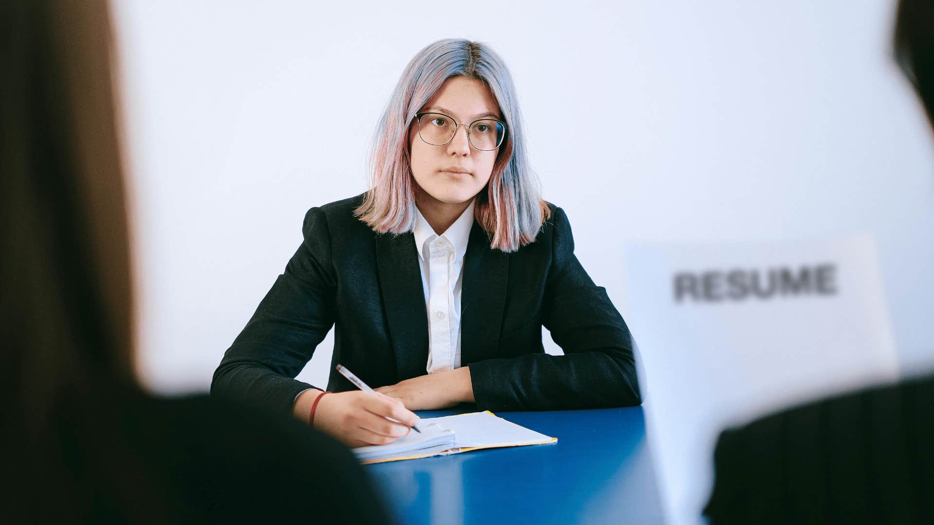 woman taking notes