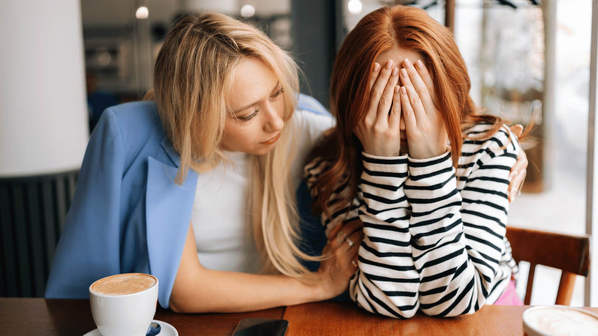 woman comforting crying friend