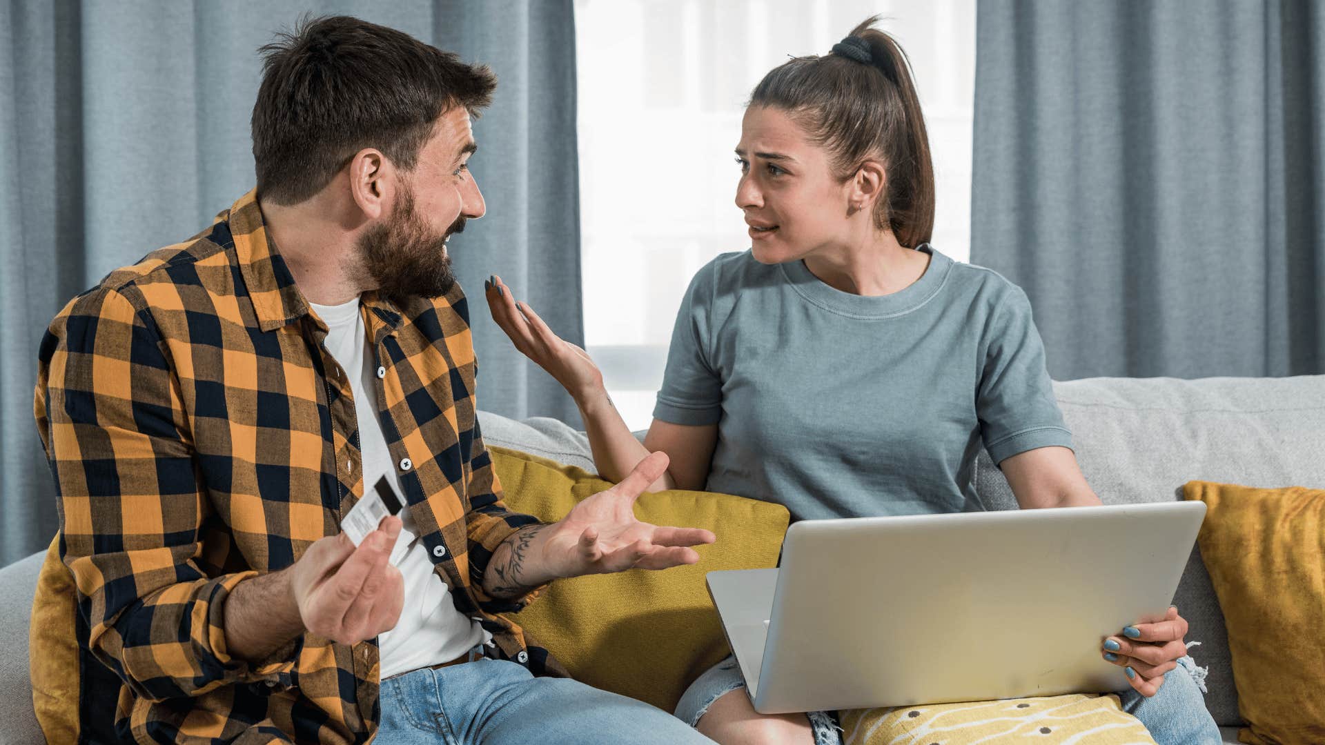 man and woman arguing about money