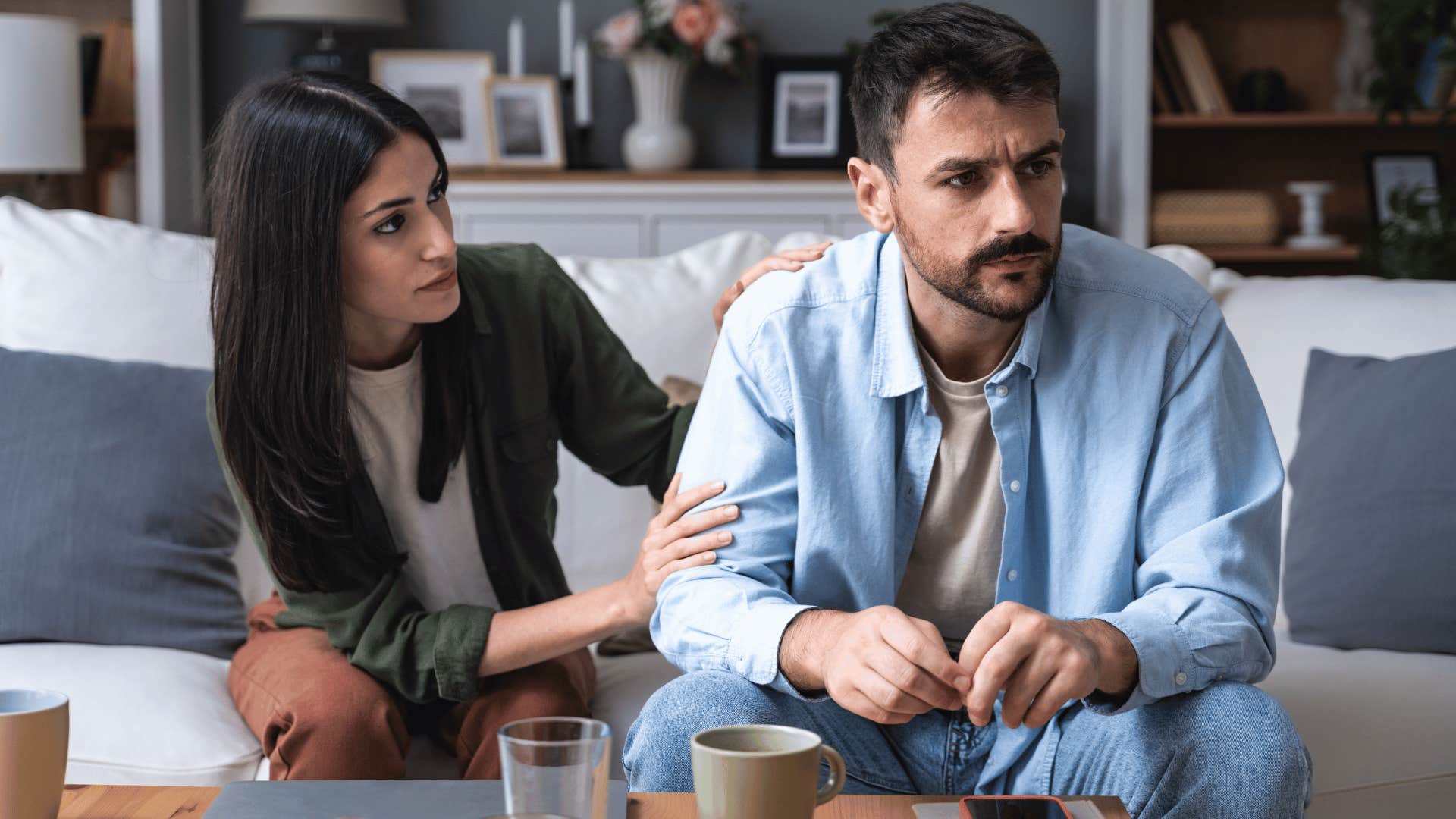 man ignoring woman while she pleads with him 