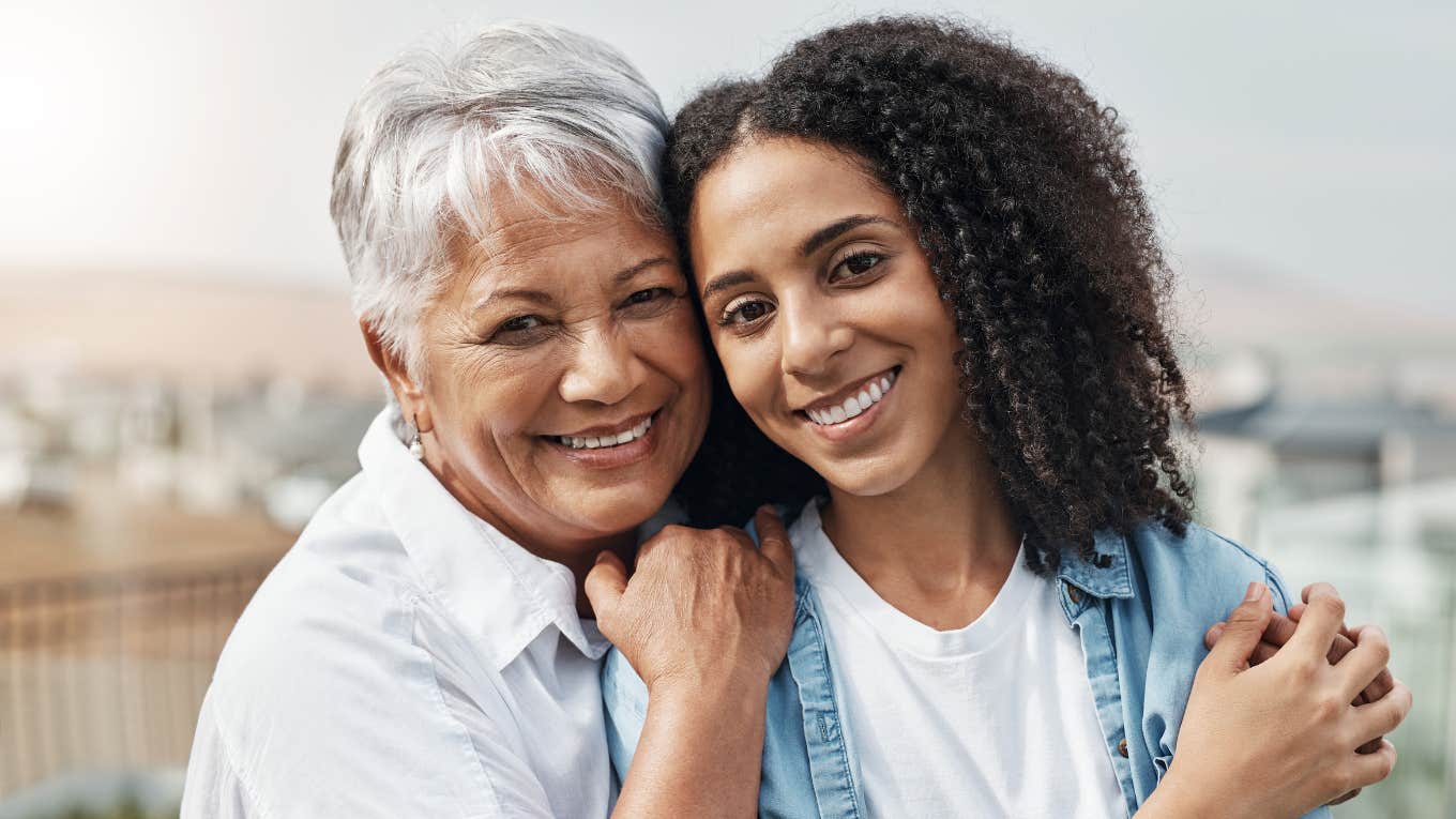 mom and adult daughter hugging