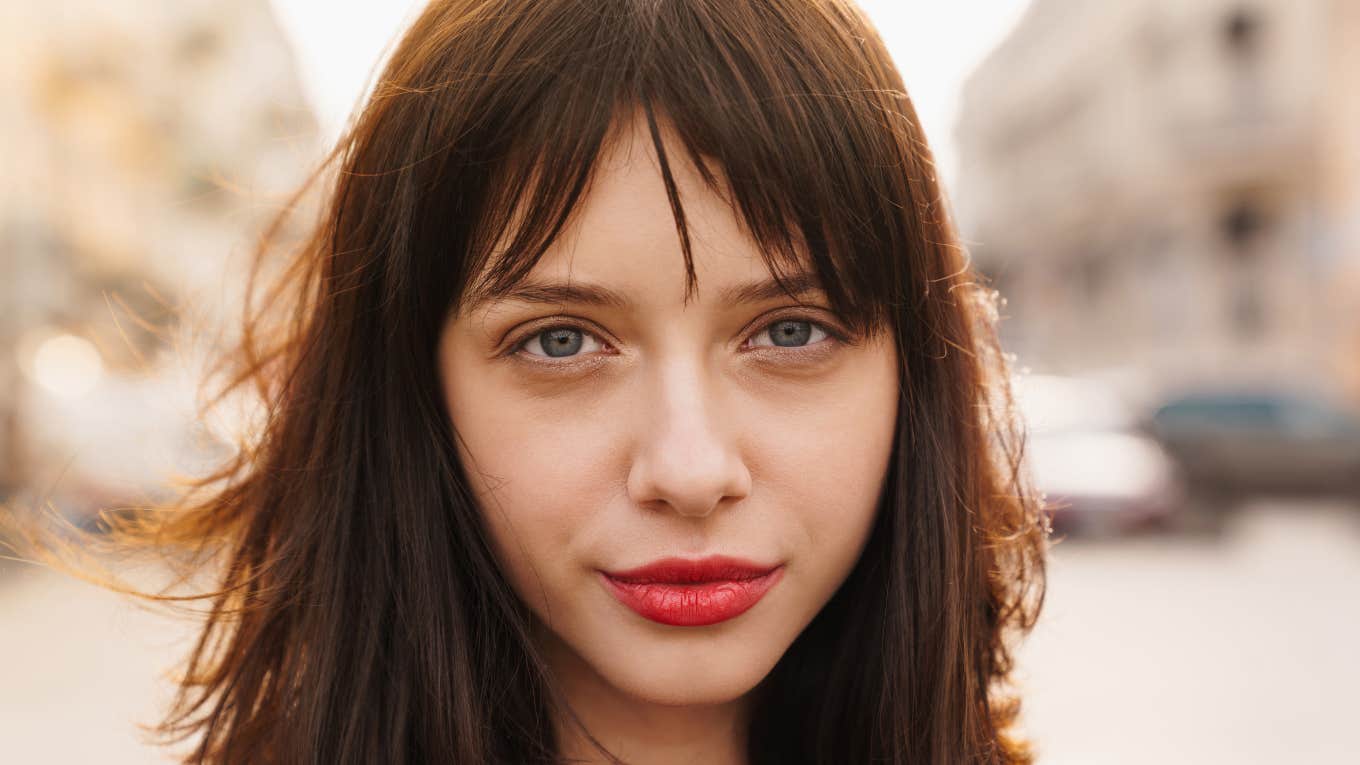 serious woman wearing red lipstick