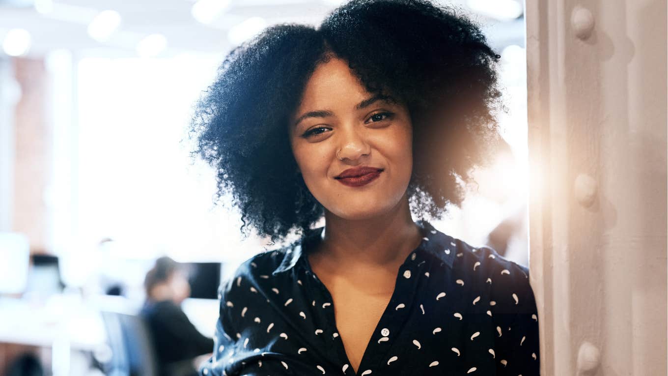 Confident woman smiling in the office.