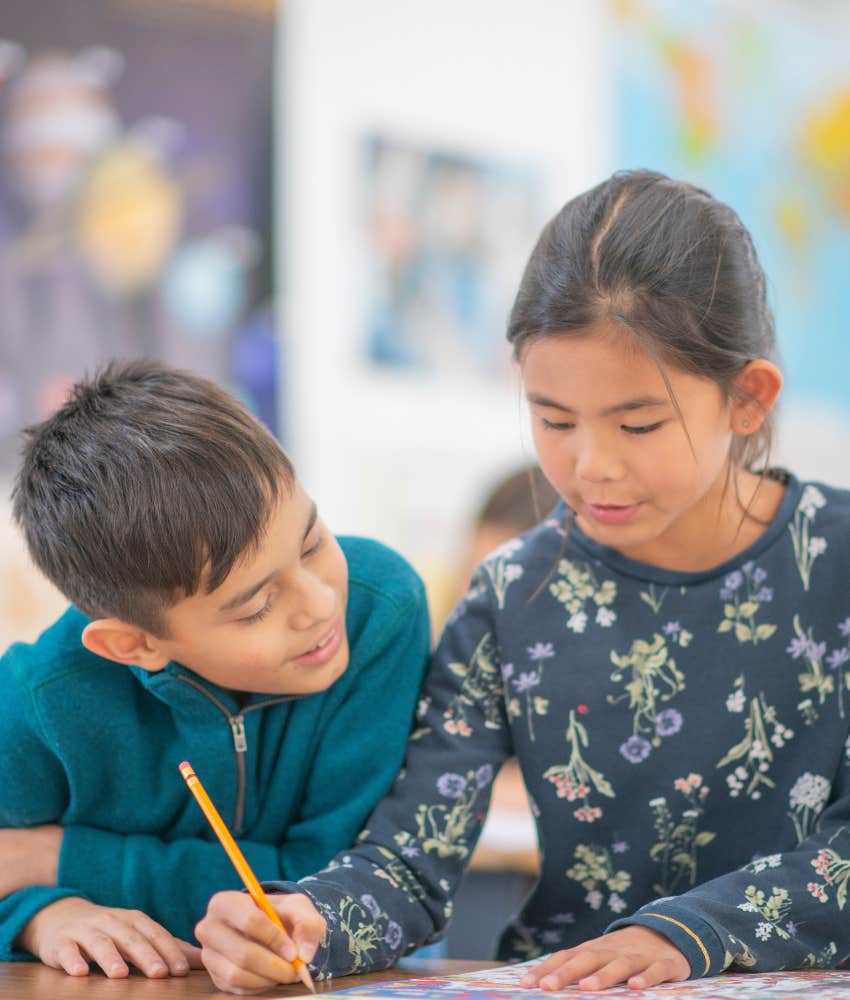 kids helping each other with class work