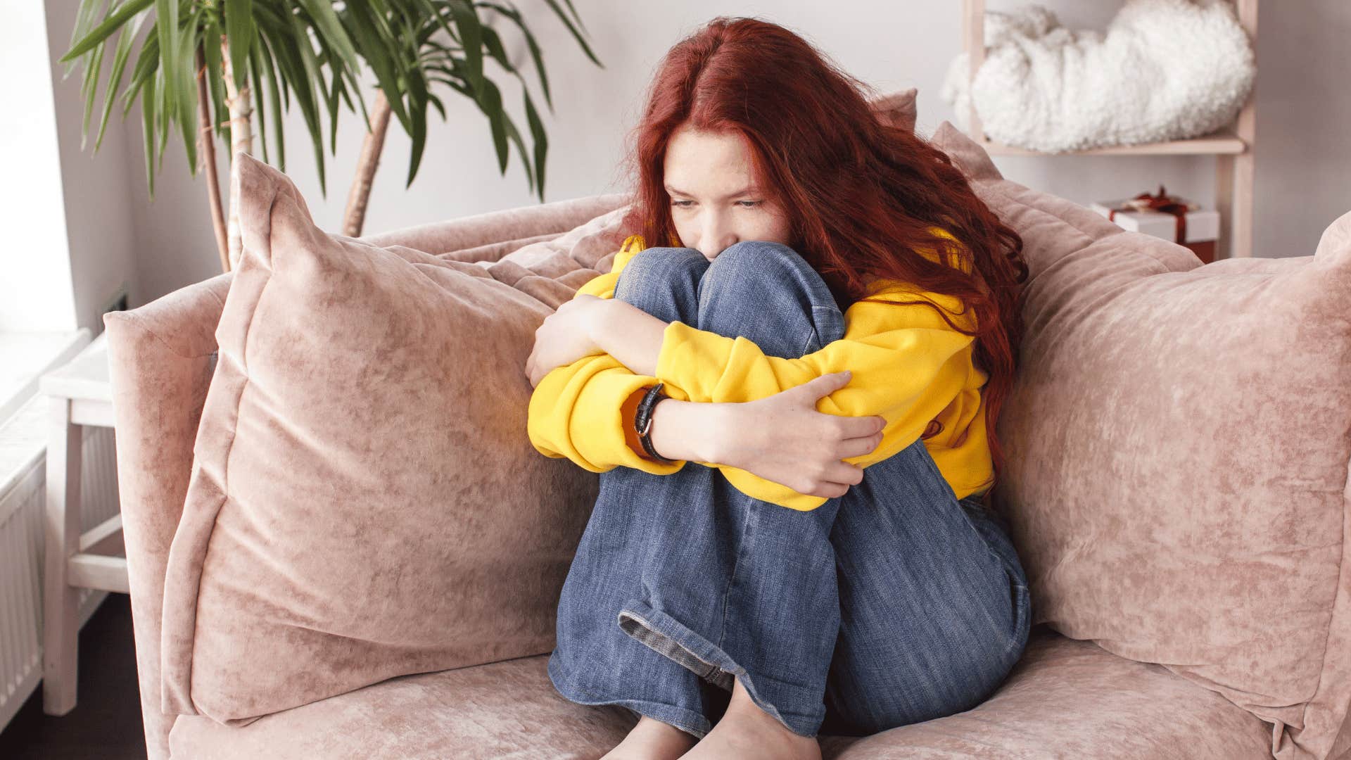 sad woman on couch