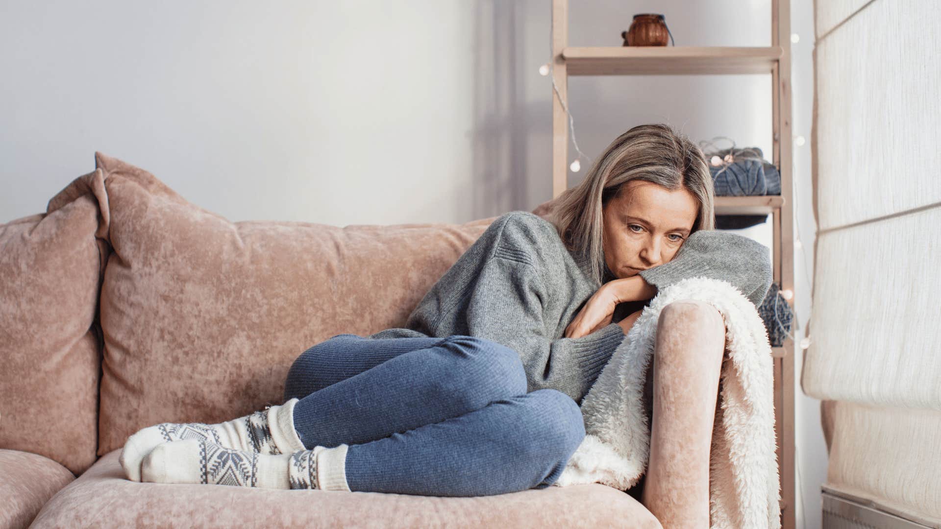 sad woman on couch