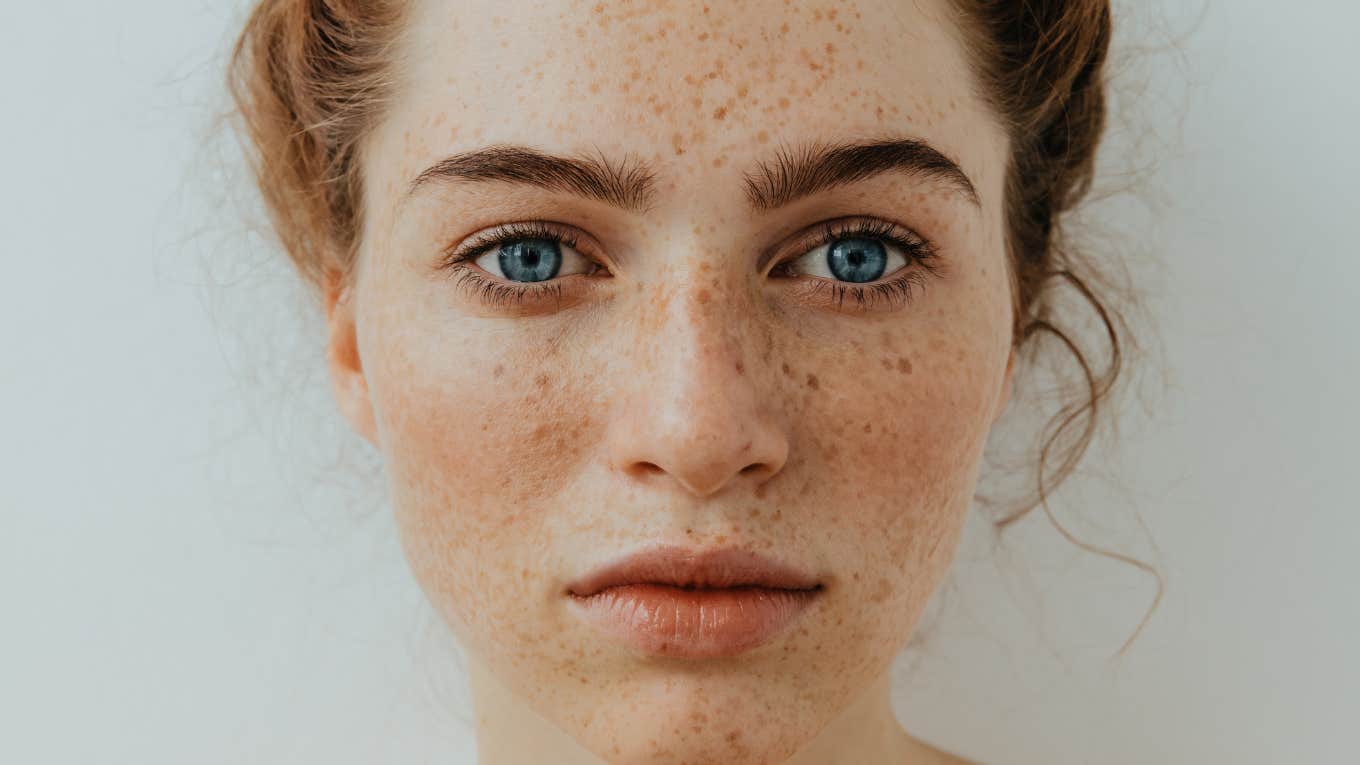 sad woman with freckles