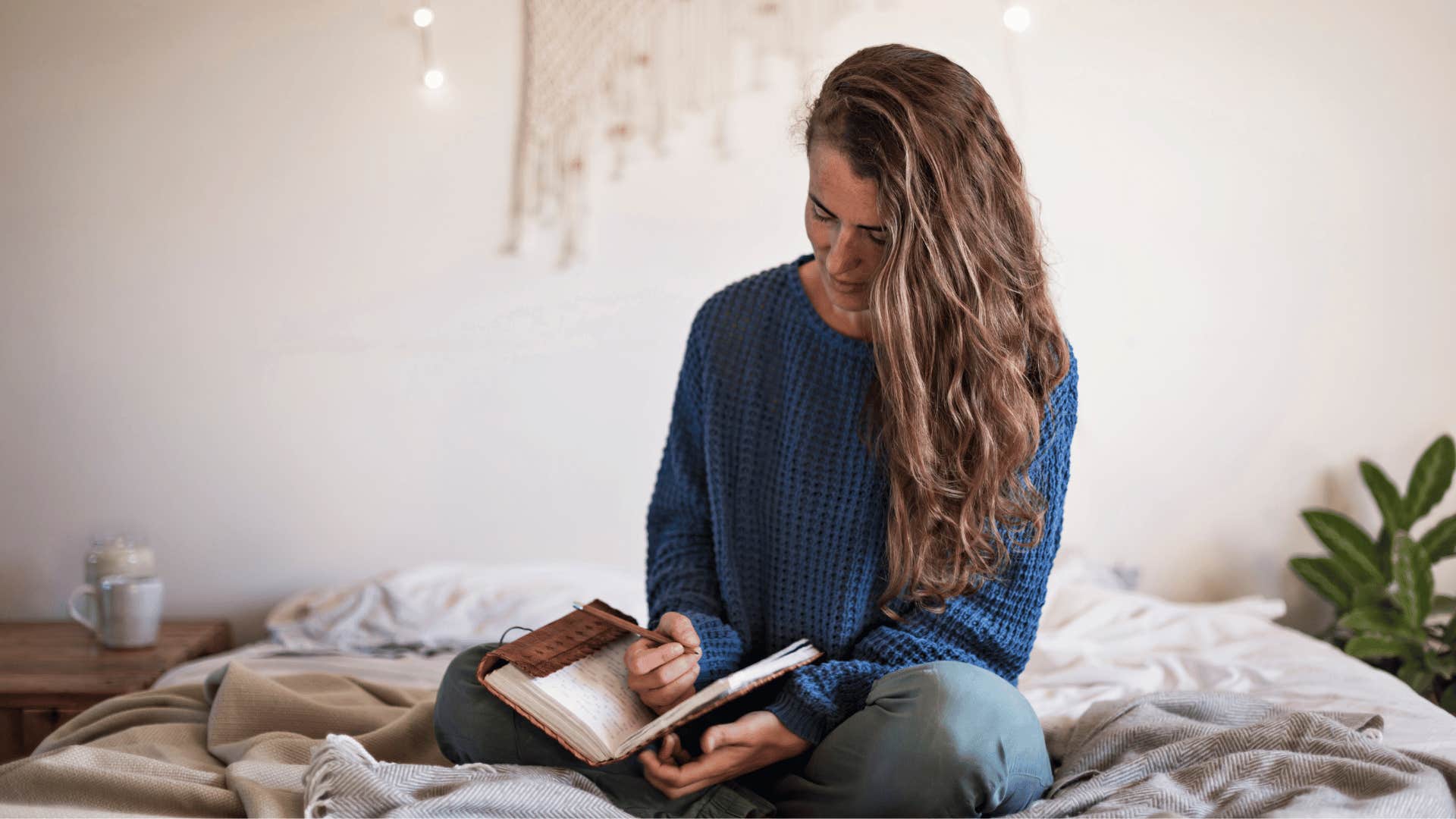 woman writing in journal 