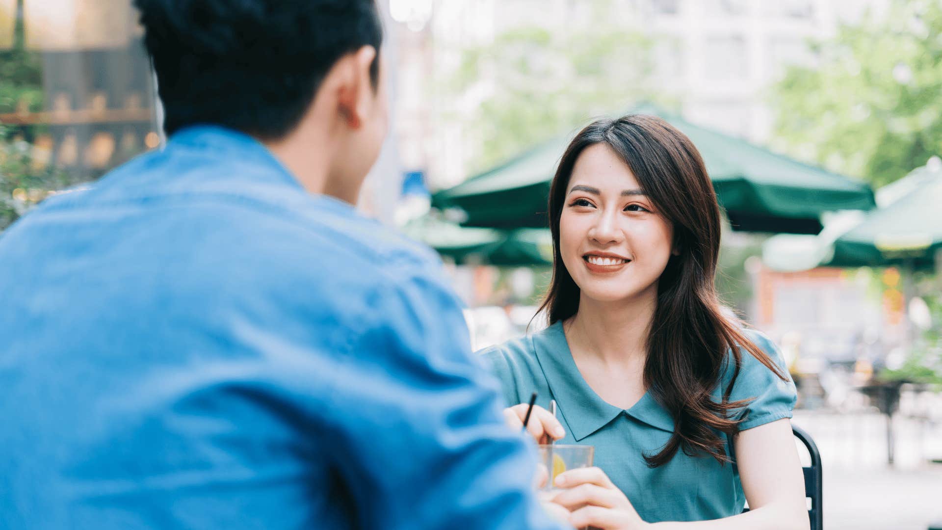 woman and man talking at cafe