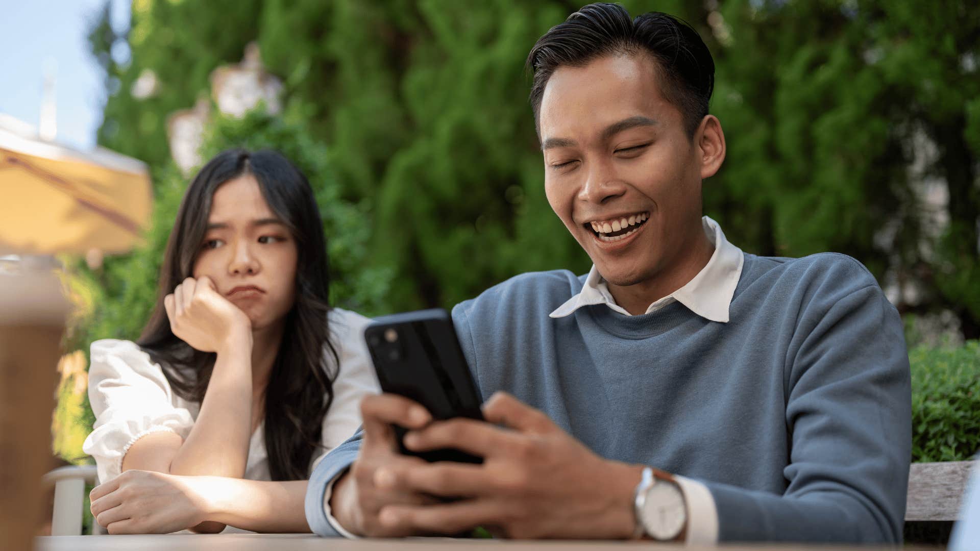 man on phone ignoring partner