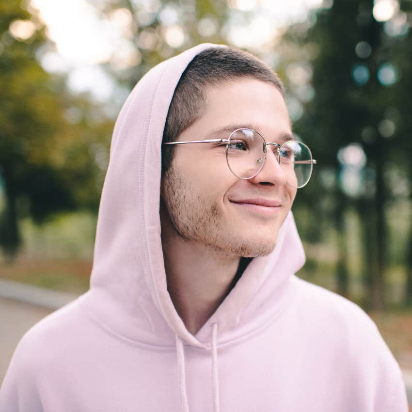 Teenager wearing a pink hoodie