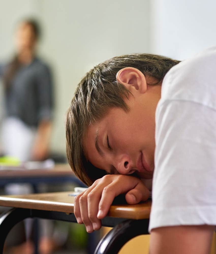 teen boy sleeping in class