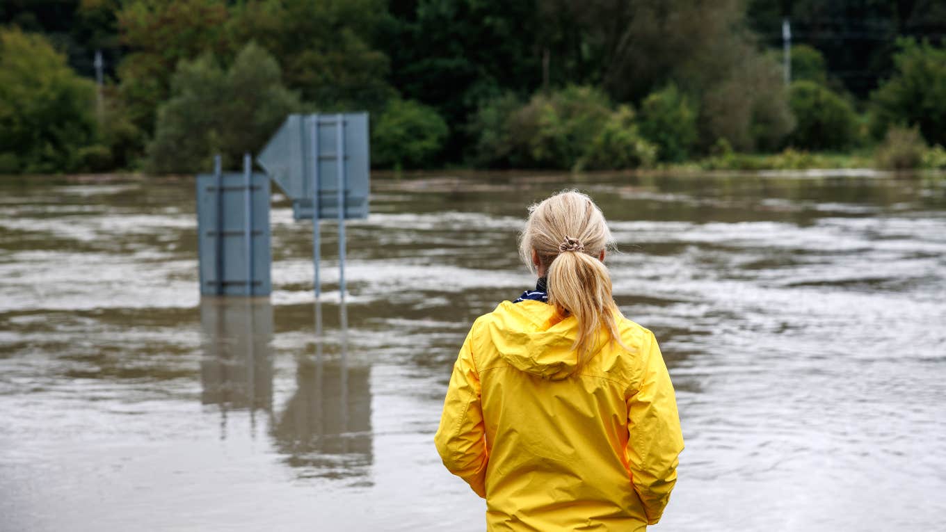 woman looking out at flood waters