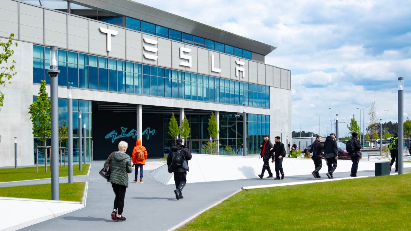 tesla workers leaving factory