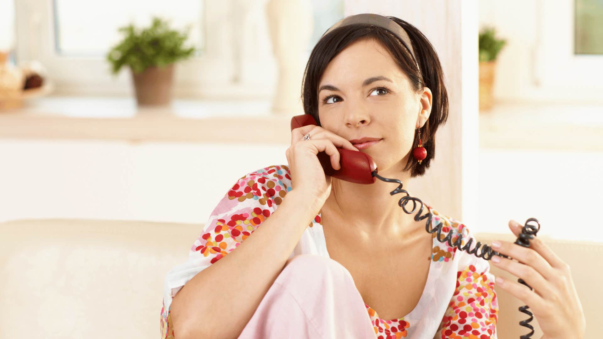 woman on landline phone 