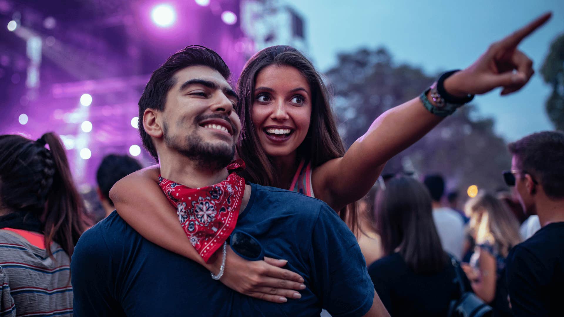 man and woman at a concert