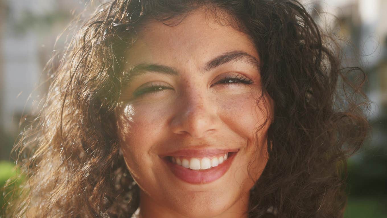 beautiful woman smiling in the sunshine