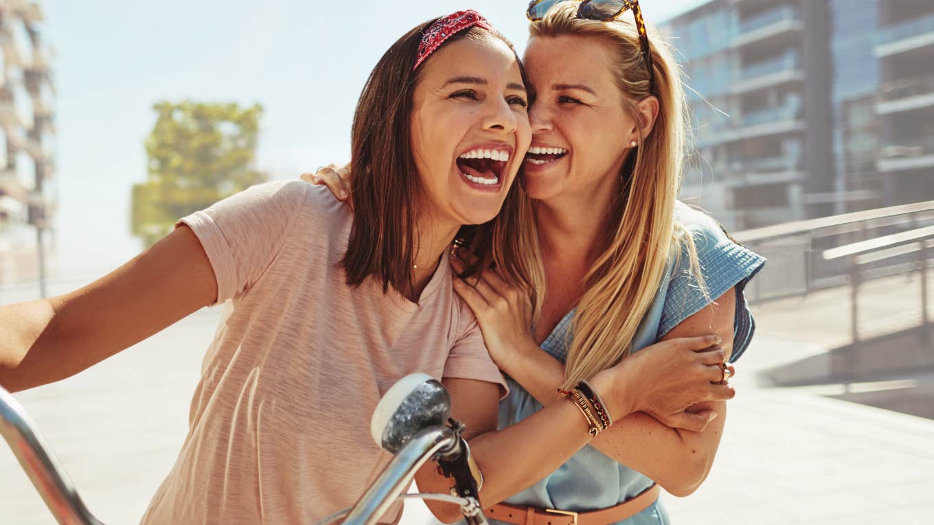 Two drama-free friends smiling and laughing together