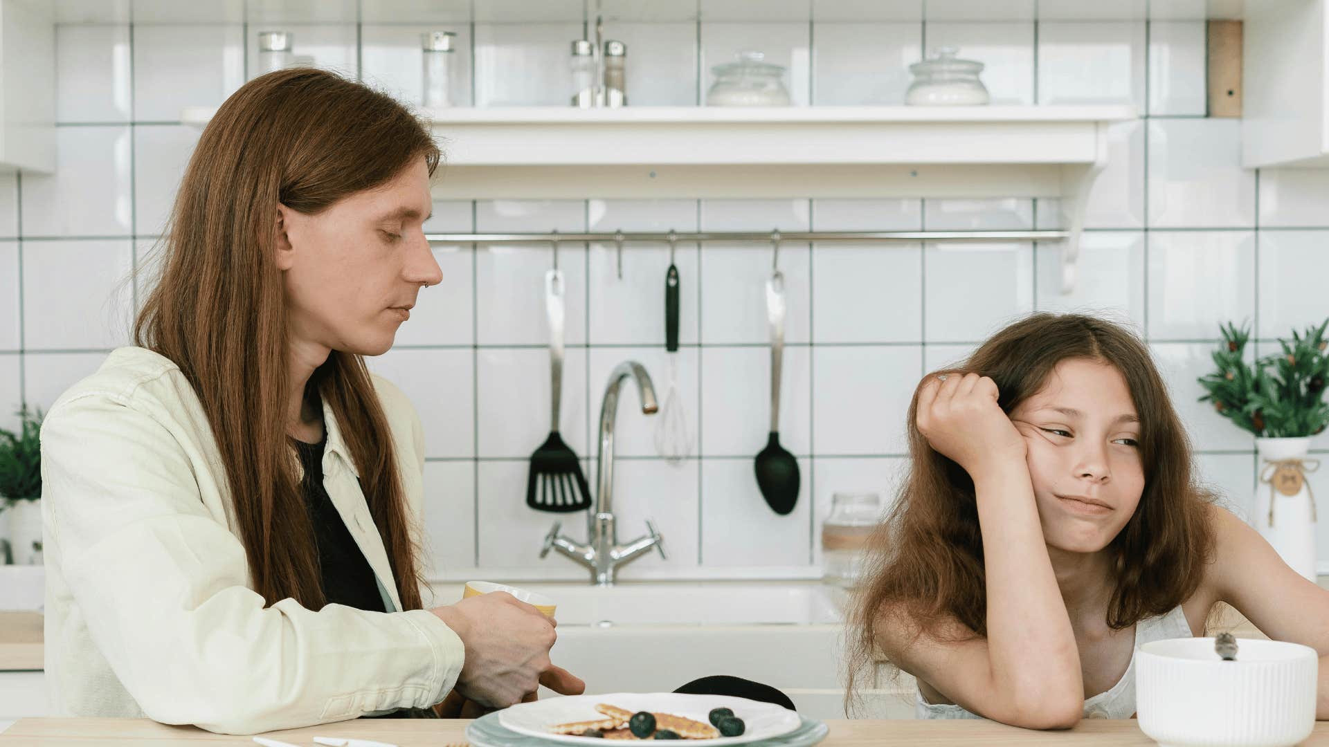 father and child sitting at breakfast