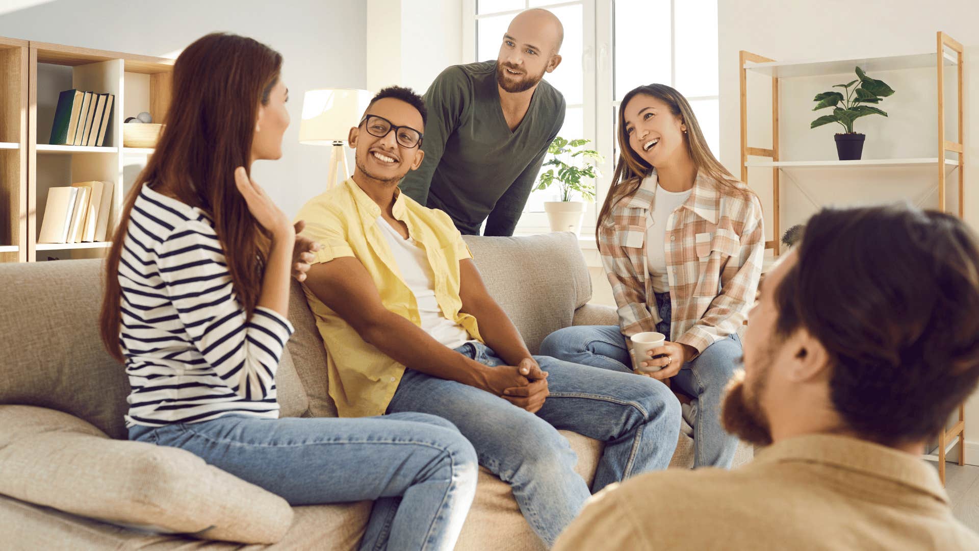 people listening as woman talks 