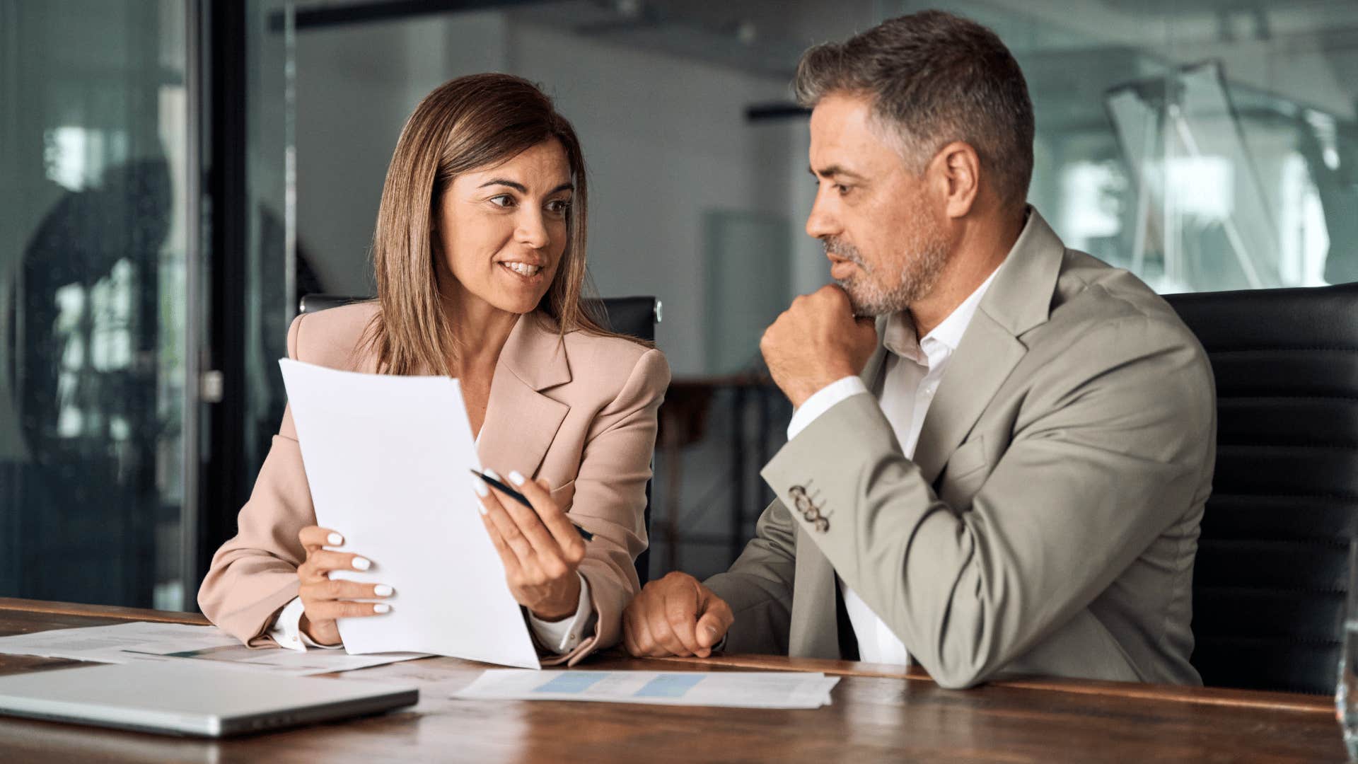 woman sharing feedback with man