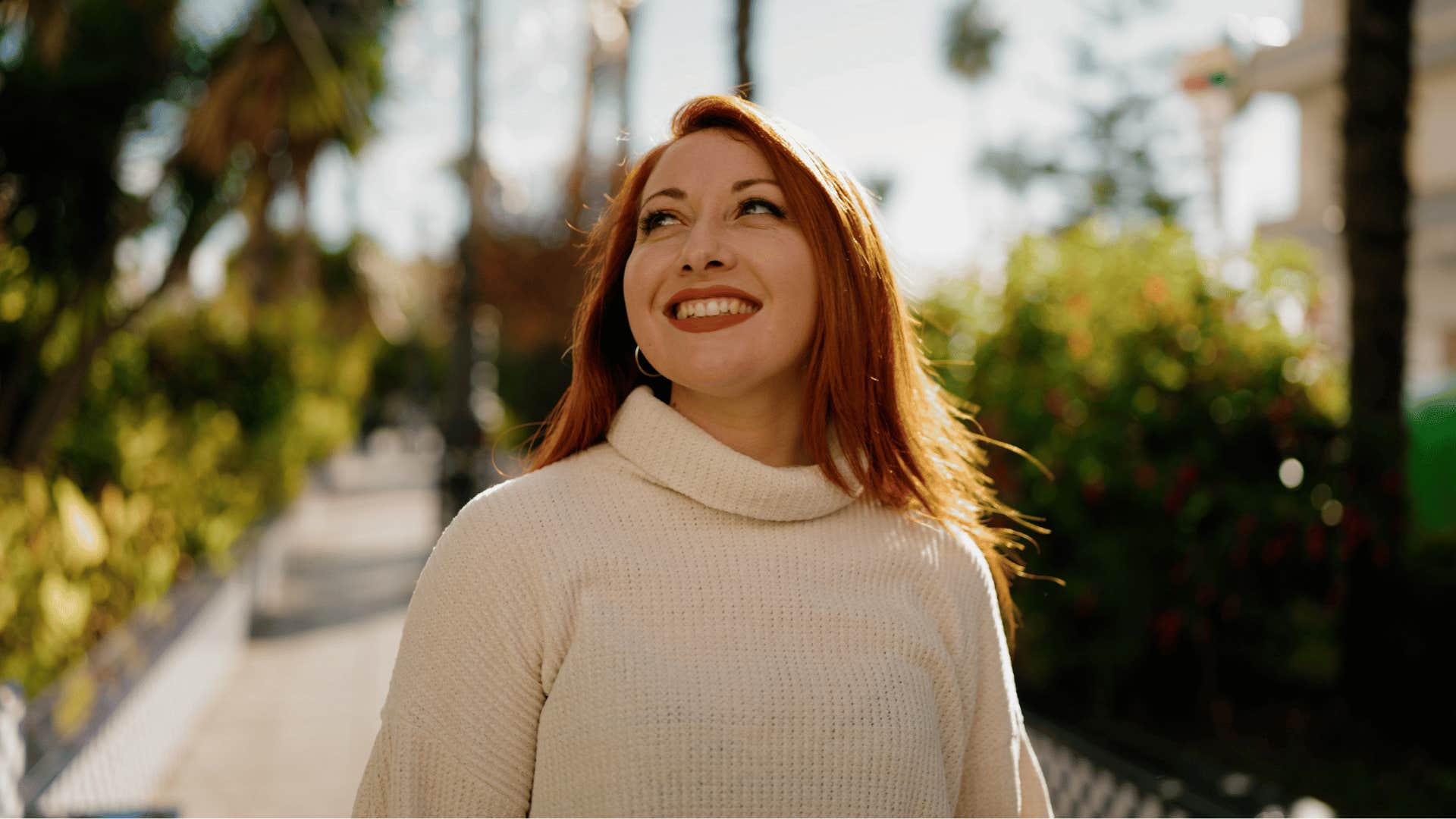 happy woman standing outside