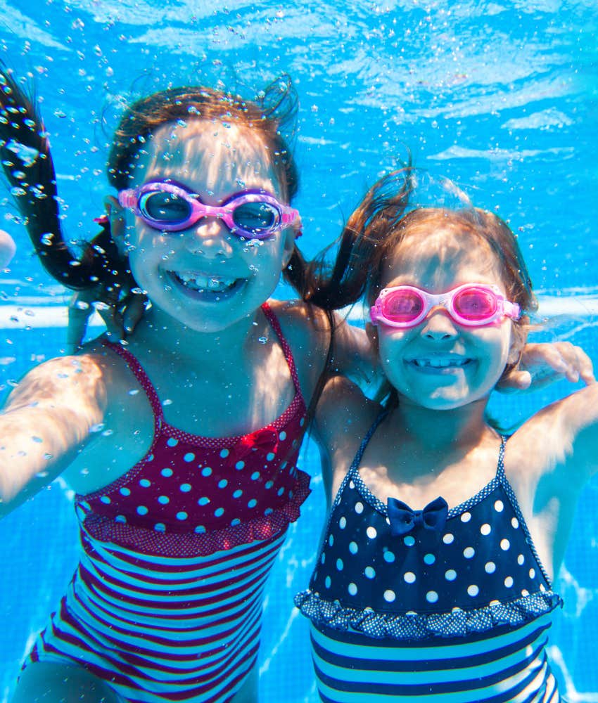 tween girls swimming in pool