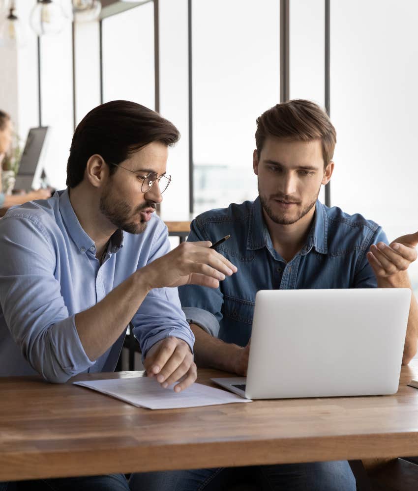 two colleagues working together on a laptop