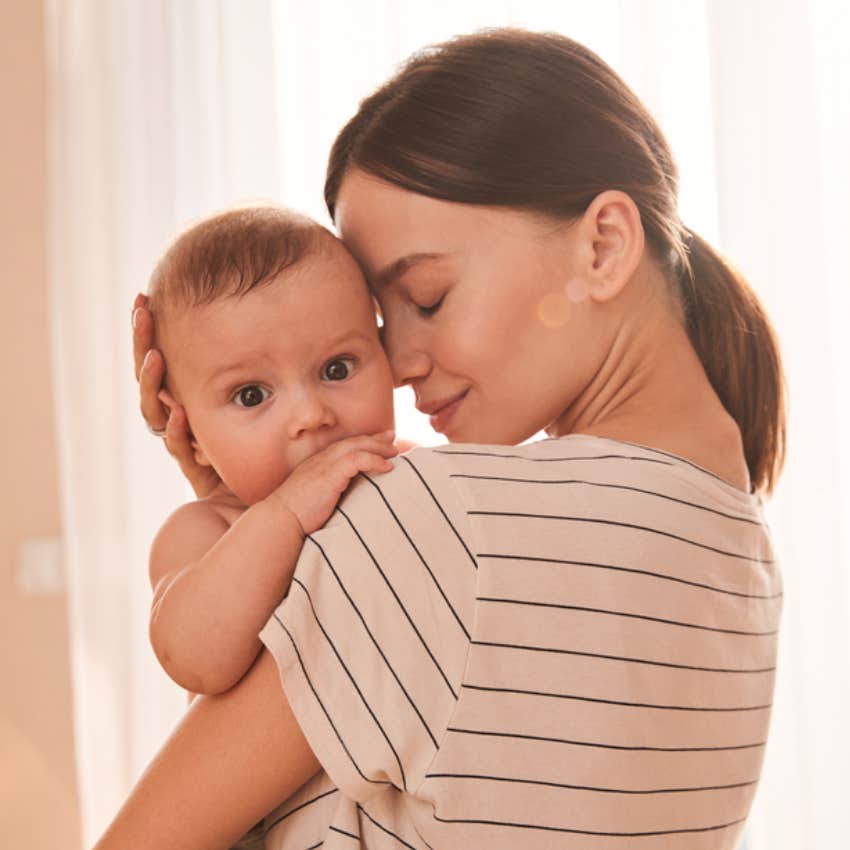 woman holding baby 