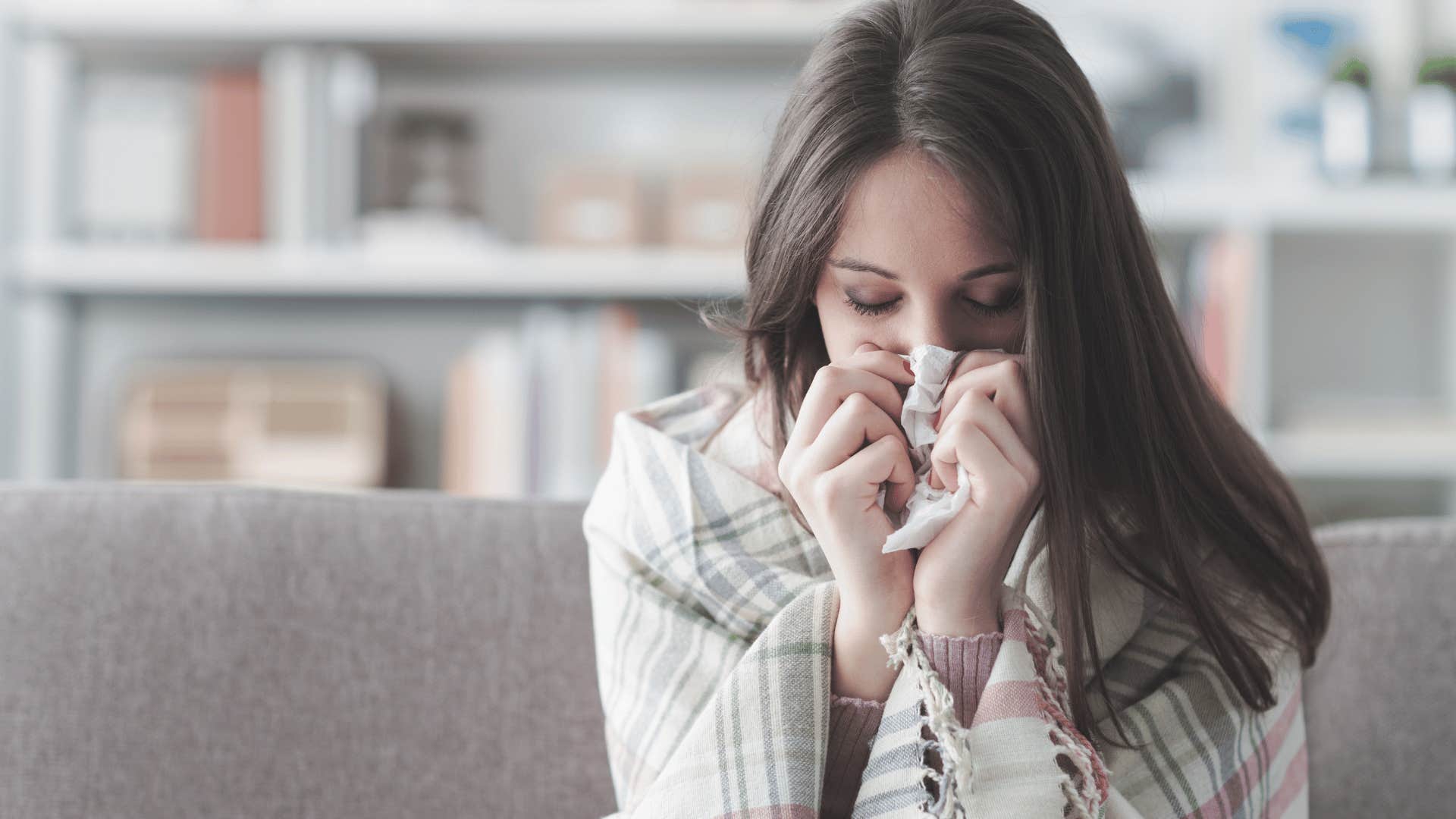 woman crying on couch