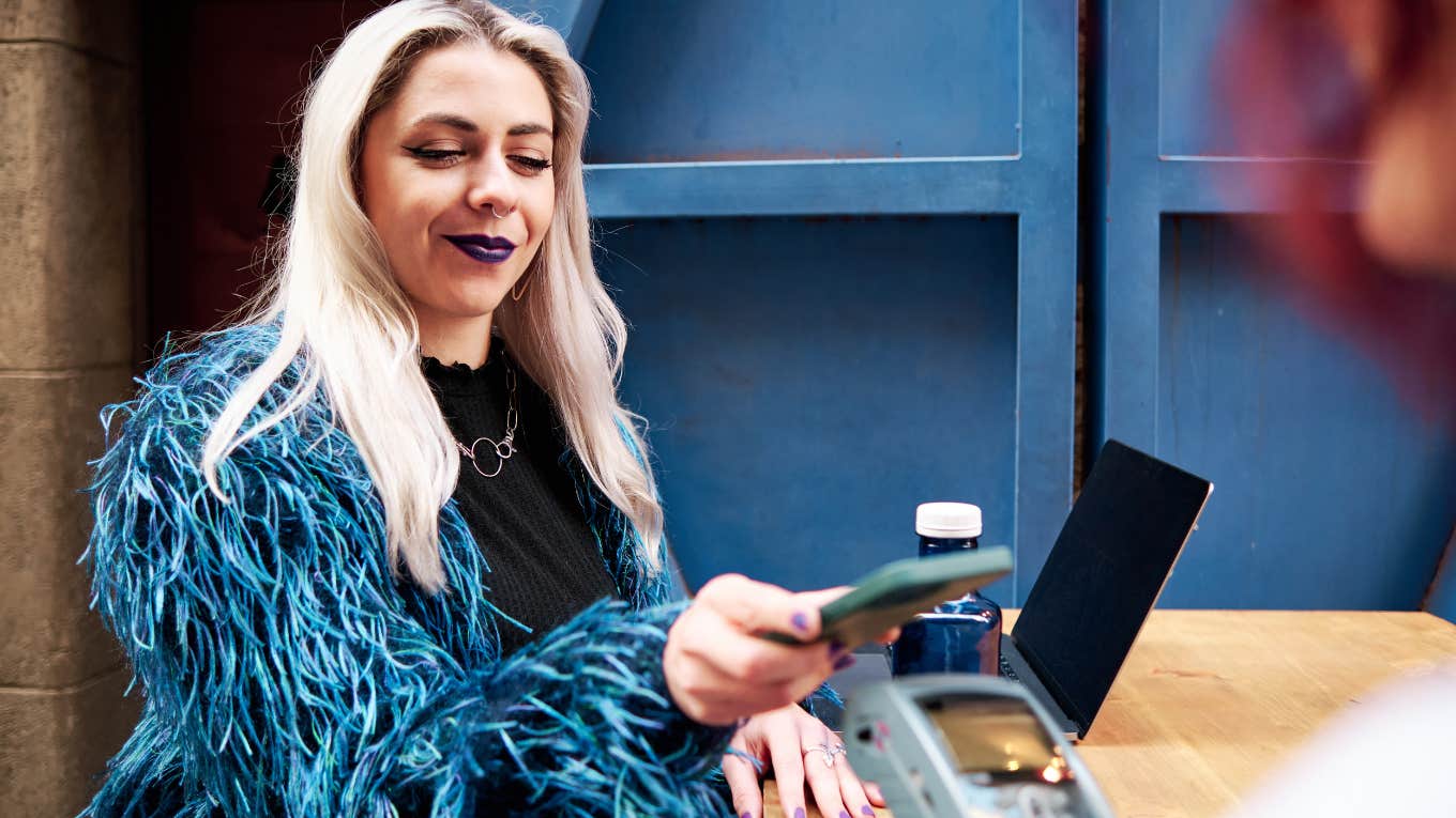 Woman paying tab while on date