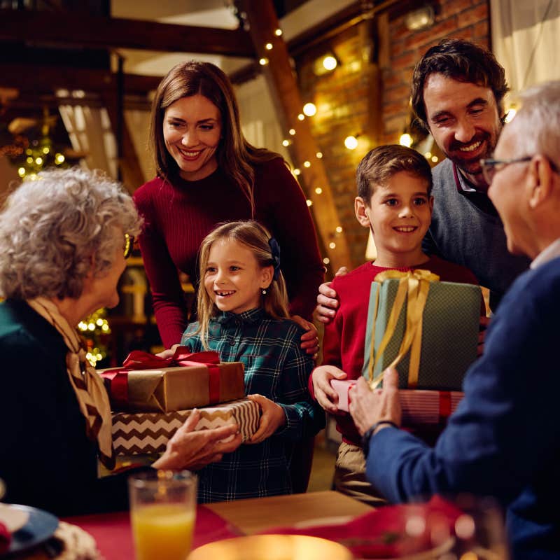 family opening presents at christmas