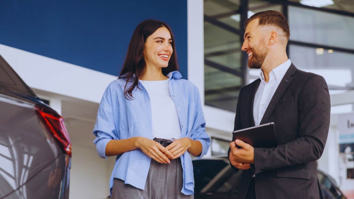 woman and car salesman