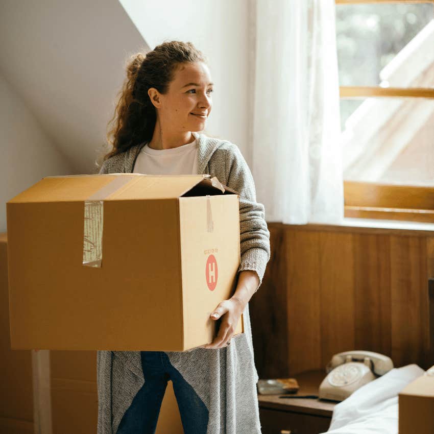 woman carrying moving box