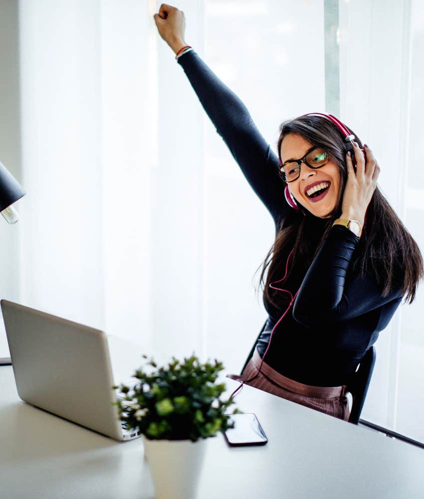 woman celebrating a good day at work